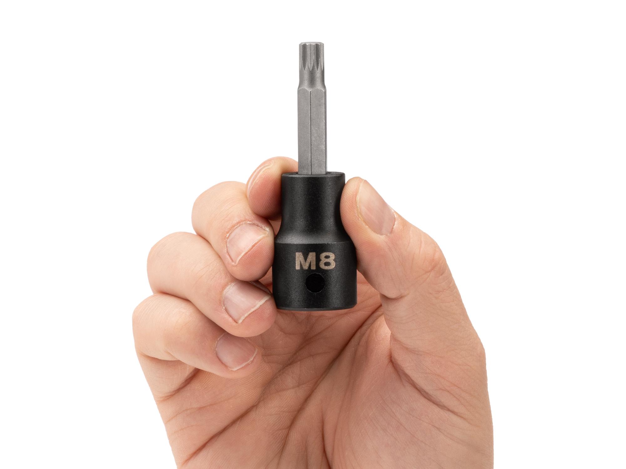 Person holding Tekton impact drive bit socket. Item #SIB28208