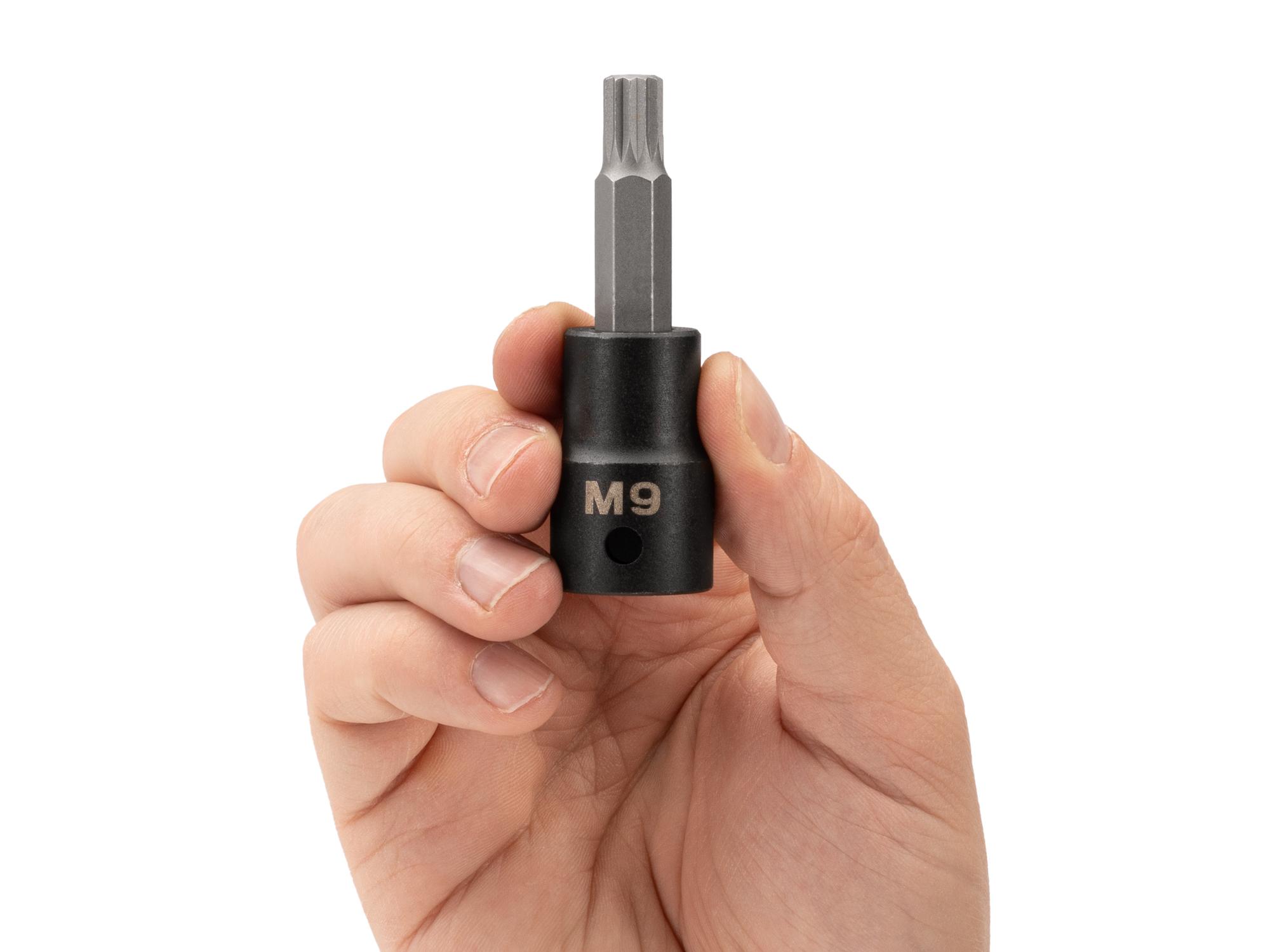 Person holding Tekton impact drive bit socket. Item #SIB28209