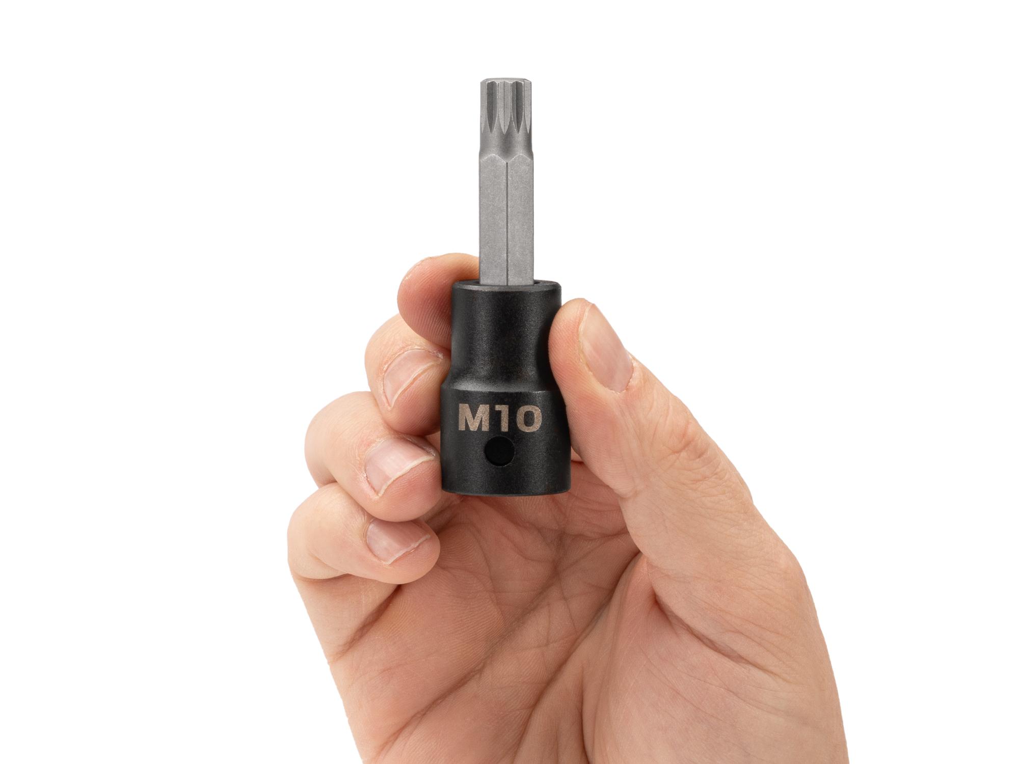 Person holding Tekton impact drive bit socket. Item #SIB28210
