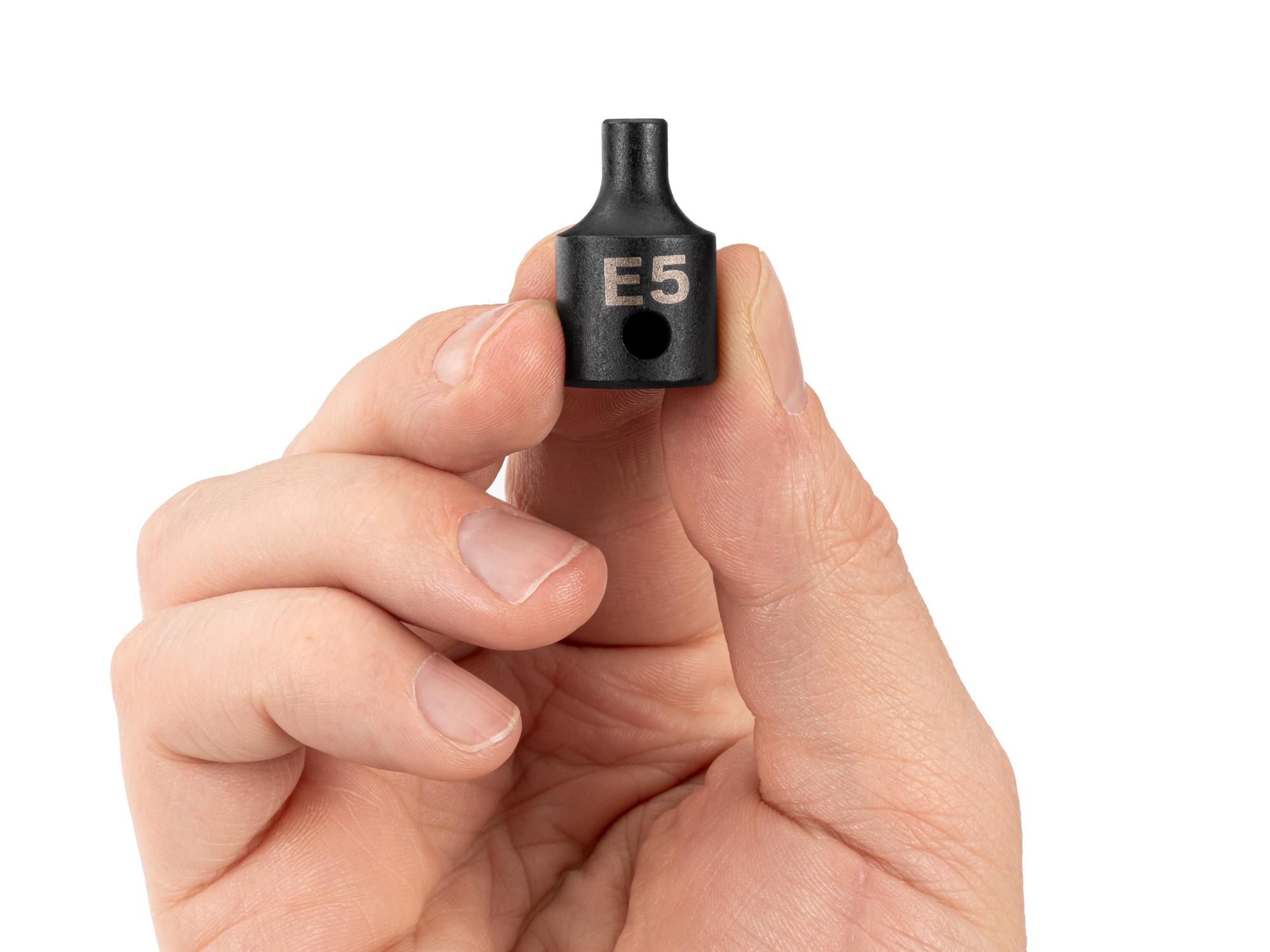 Person holding Tekton impact drive external star socket. Item #SID12405
