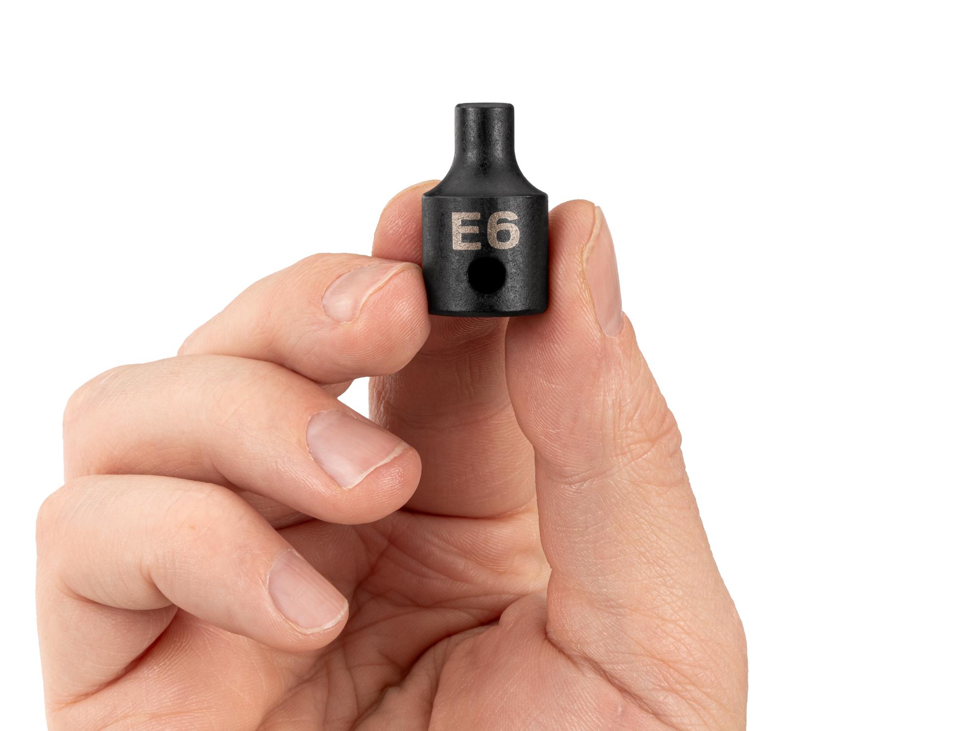 Person holding Tekton impact drive external star socket. Item #SID12406