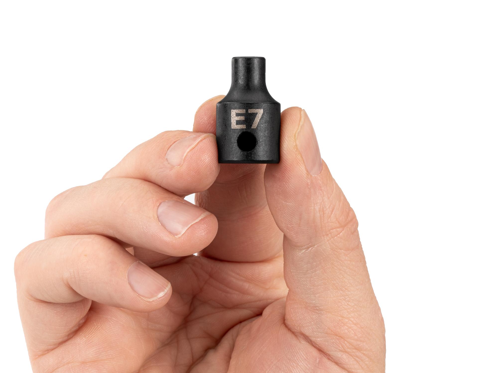 Person holding Tekton impact drive external star socket. Item #SID12407