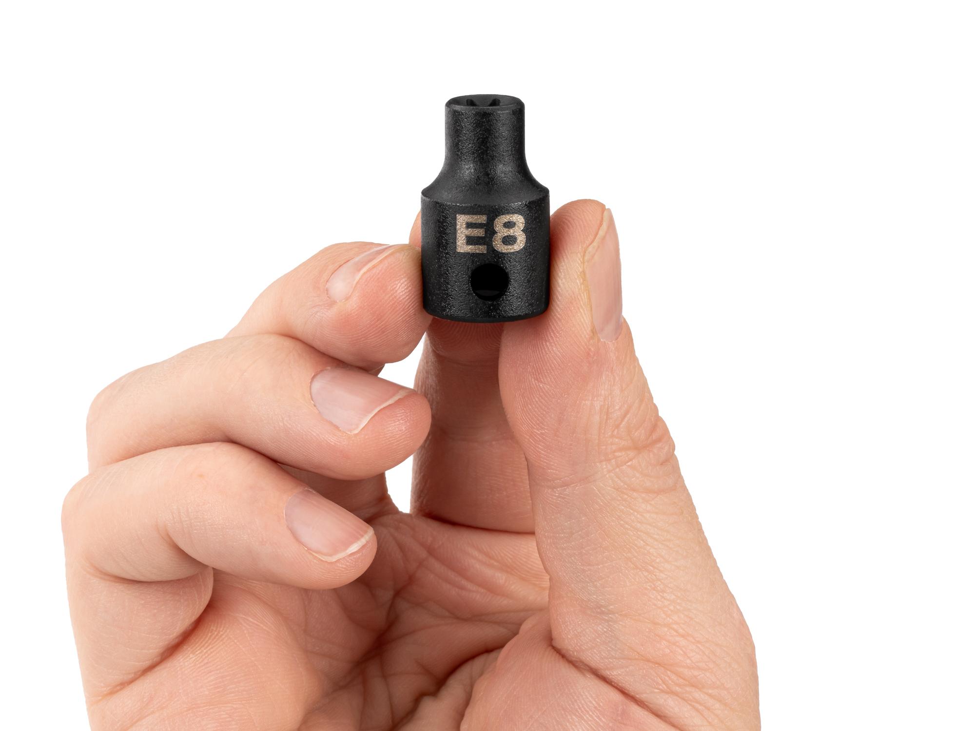 Person holding Tekton impact drive external star socket. Item #SID12408