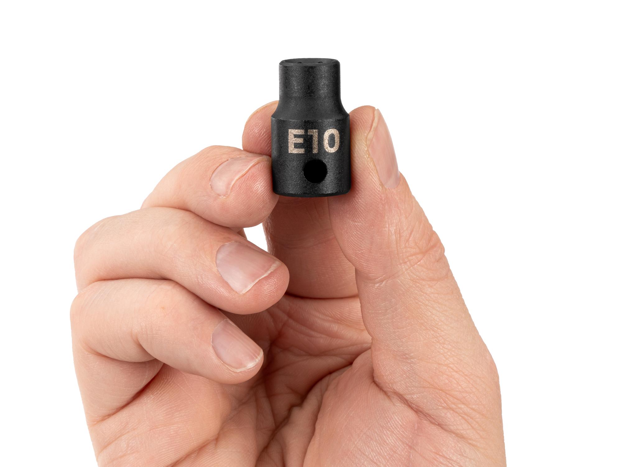 Person holding Tekton impact drive external star socket. Item #SID12410