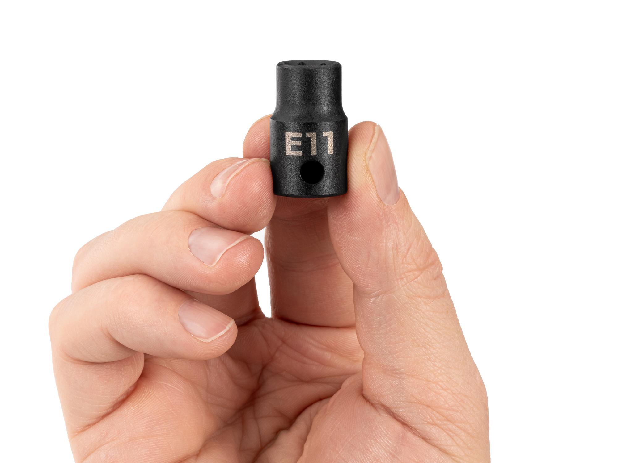 Person holding Tekton impact drive external star socket. Item #SID12411