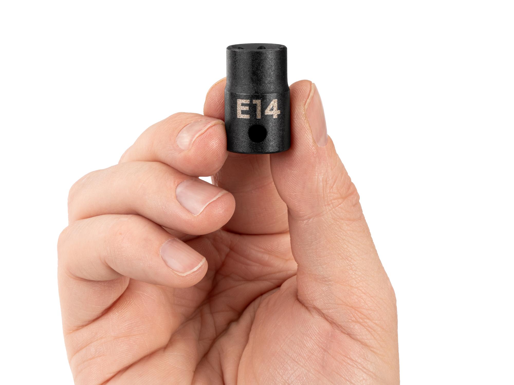 Person holding Tekton impact drive external star socket. Item #SID12414