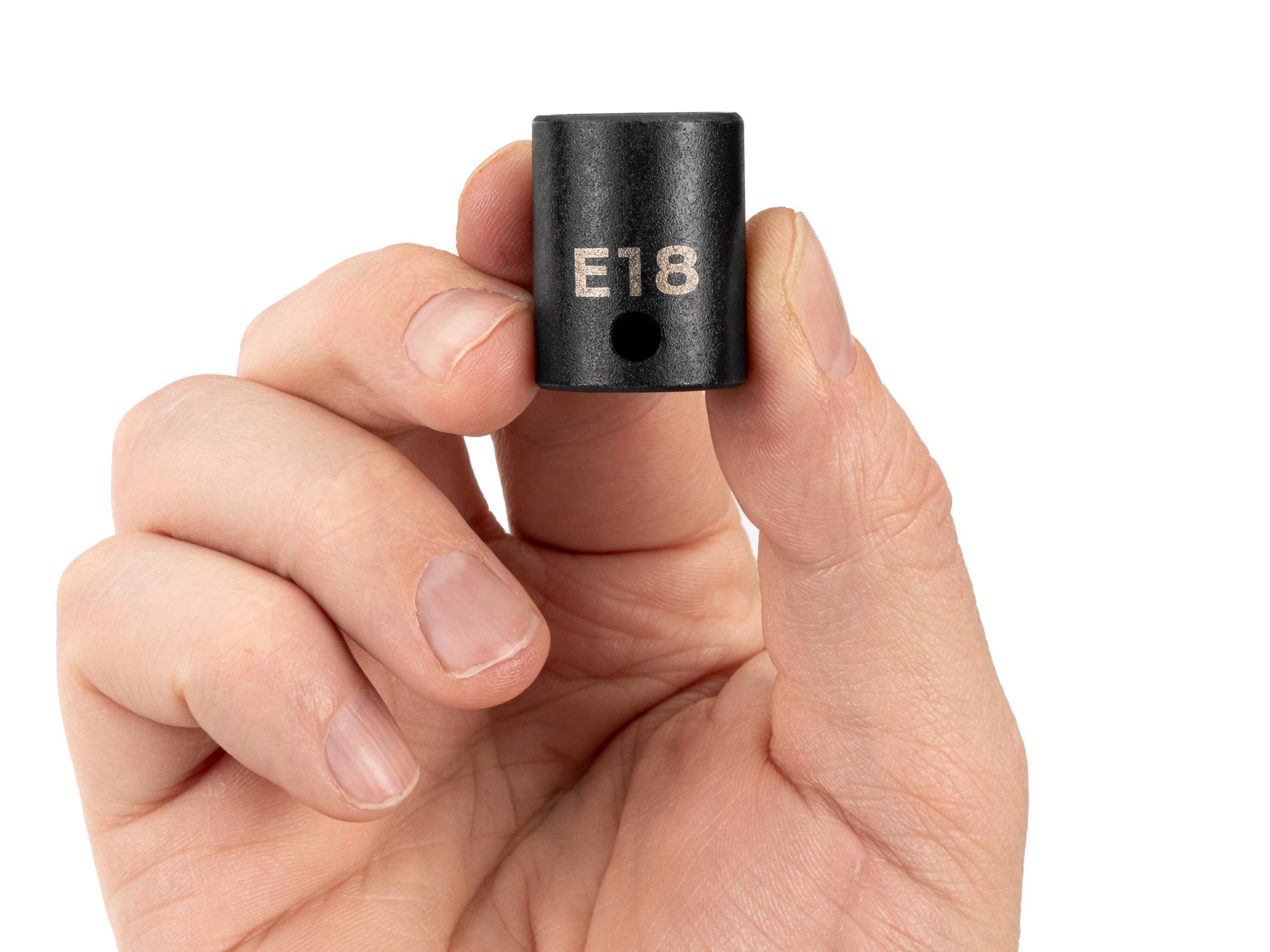 Person holding Tekton impact drive external star socket. Item #SID12418