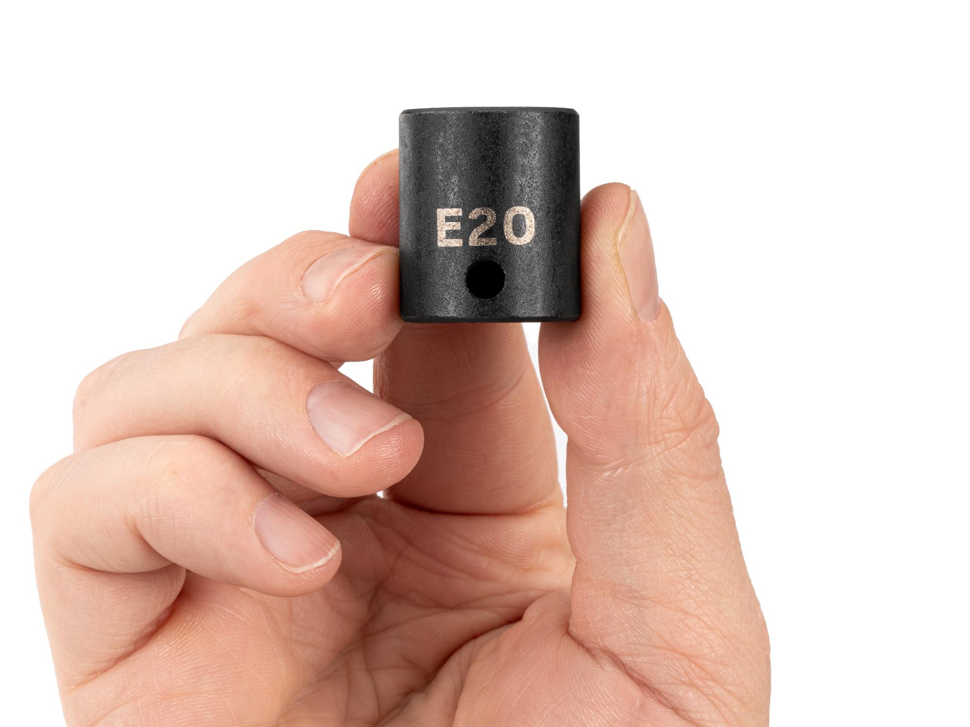 Person holding Tekton impact drive external star socket. Item #SID12420