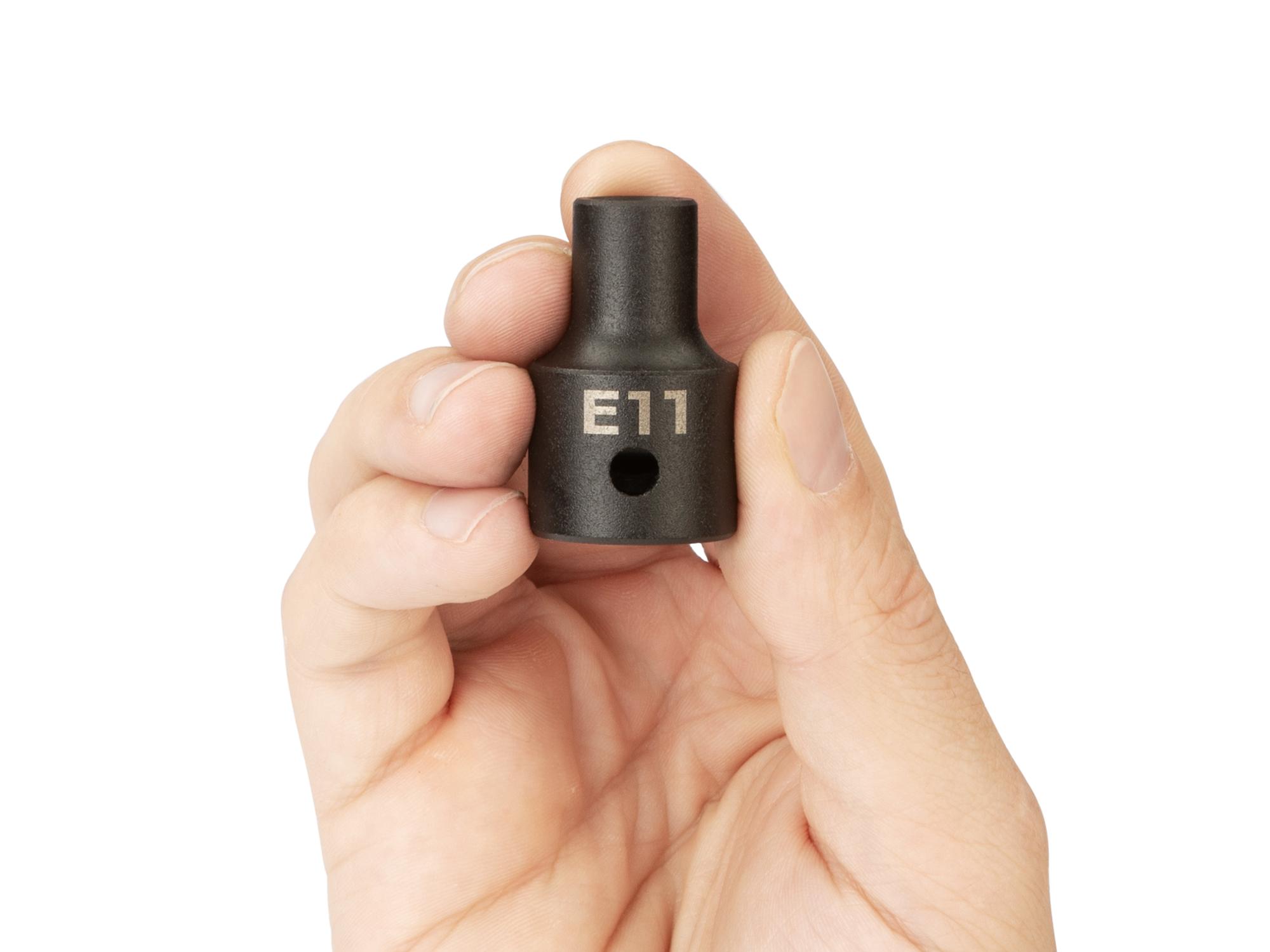 Person holding Tekton impact drive external star socket. Item #SID22411