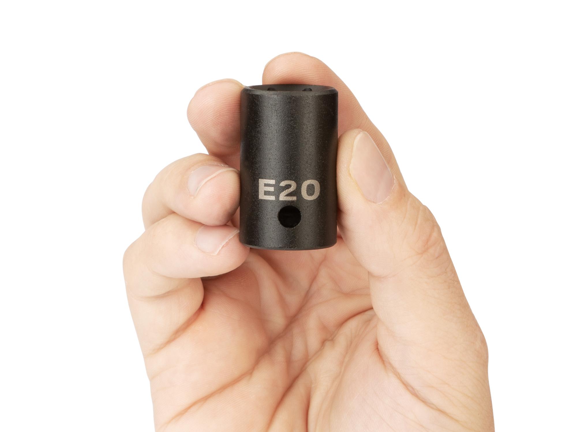 Person holding Tekton impact drive external star socket. Item #SID22420