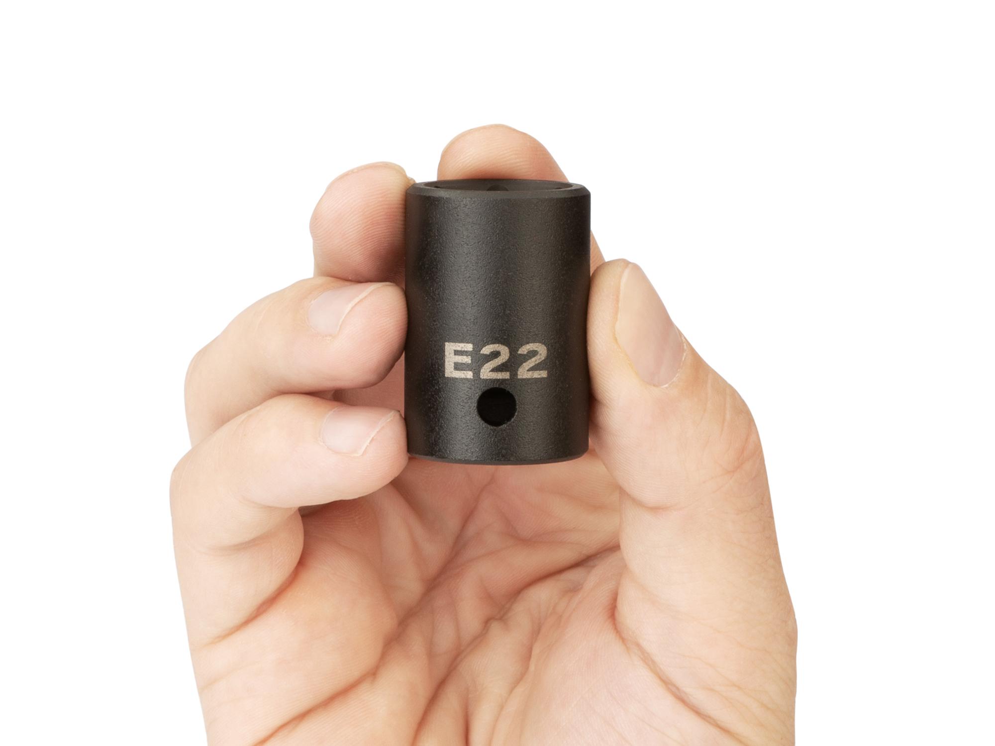 Person holding Tekton impact drive external star socket. Item #SID22422