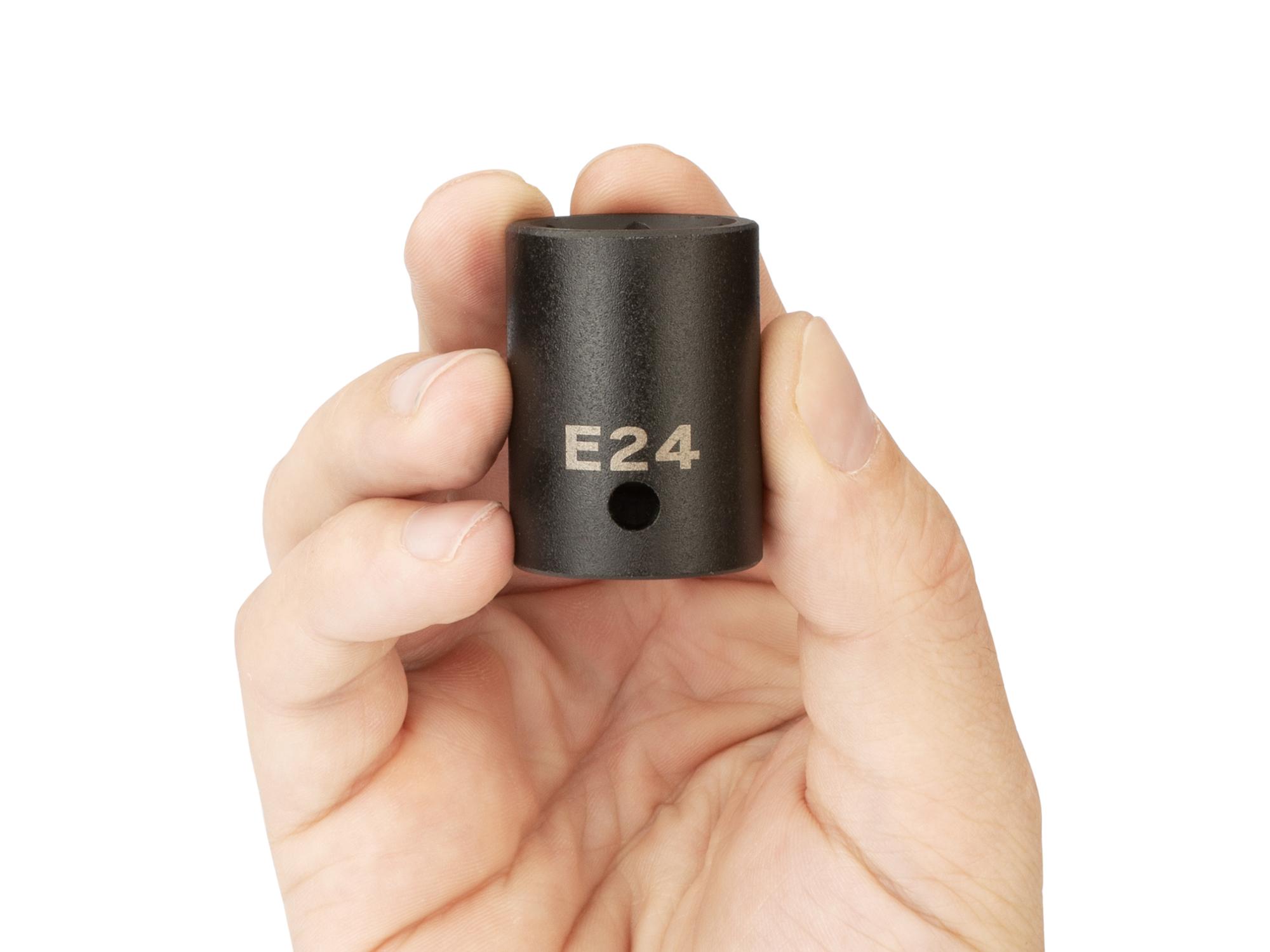 Person holding Tekton impact drive external star socket. Item #SID22424