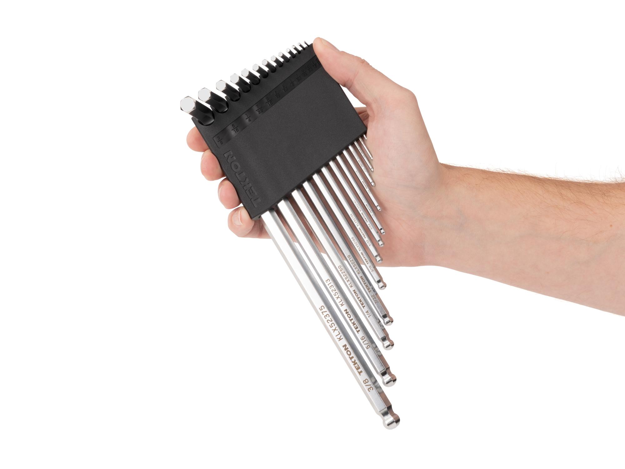 Person holding Tekton holder l-key set. Item #KLX91101