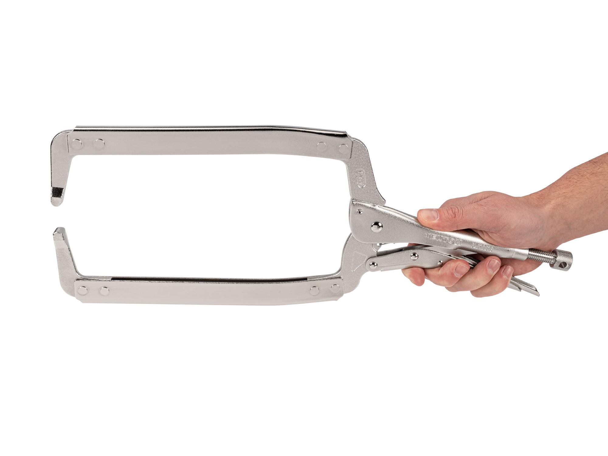 Person holding Tekton 18 inch locking clamp. Item #CLC10018