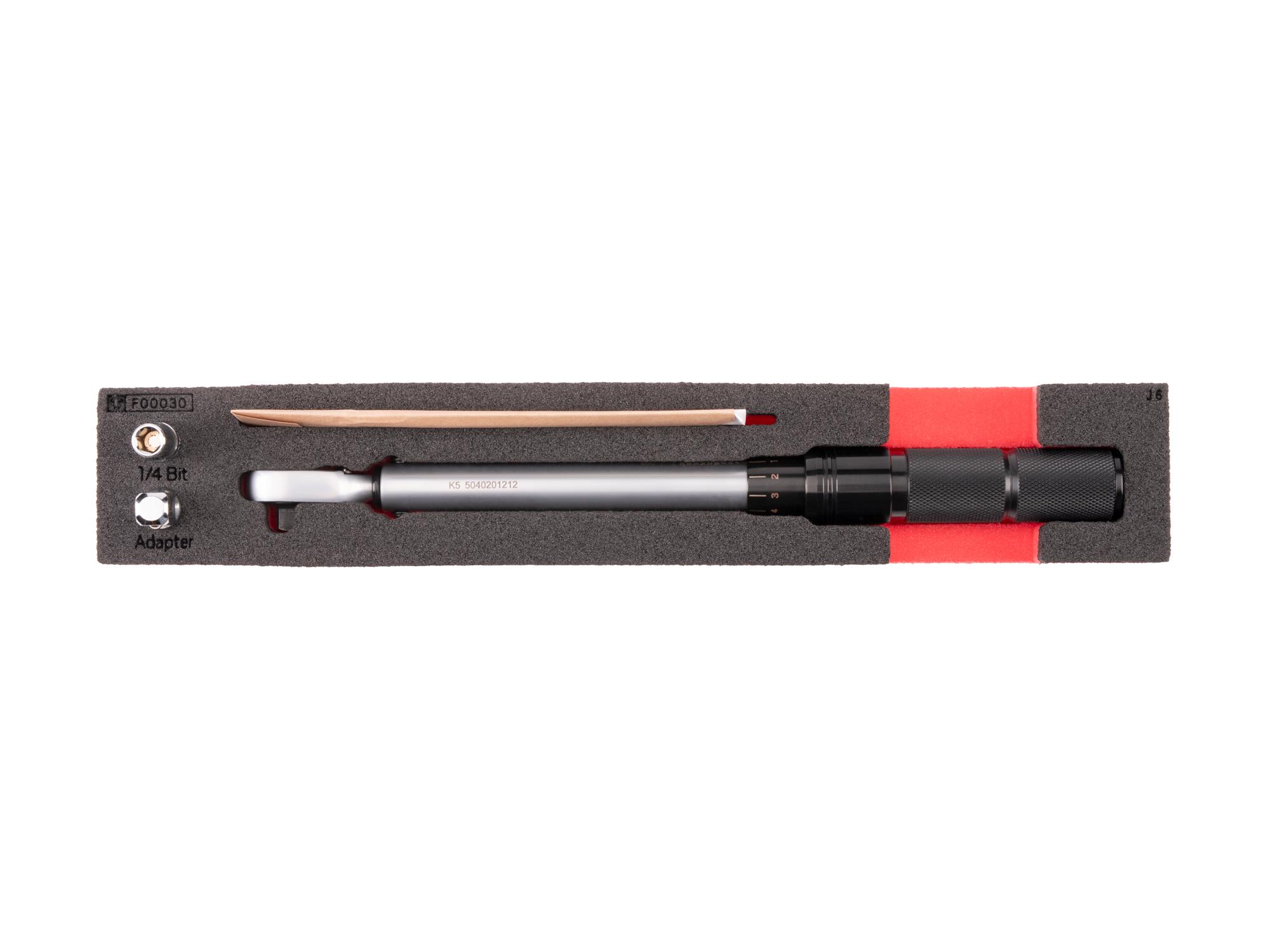 Top view of Tekton 1/4 inch drive micrometer torque wrench with foam organizer. TRQ95001
