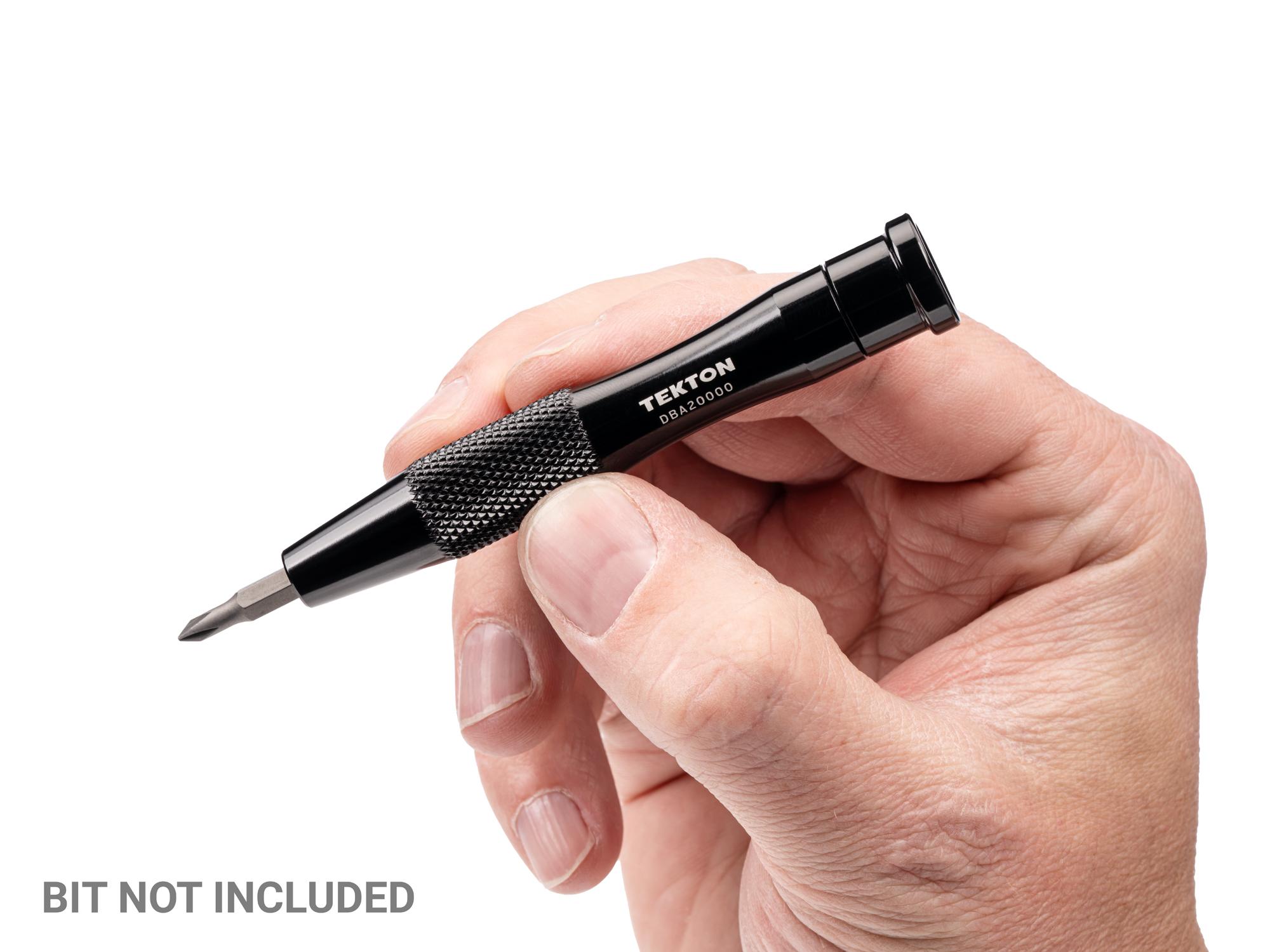 Person holding Tekton multi-bit driver. Item #DBA20000