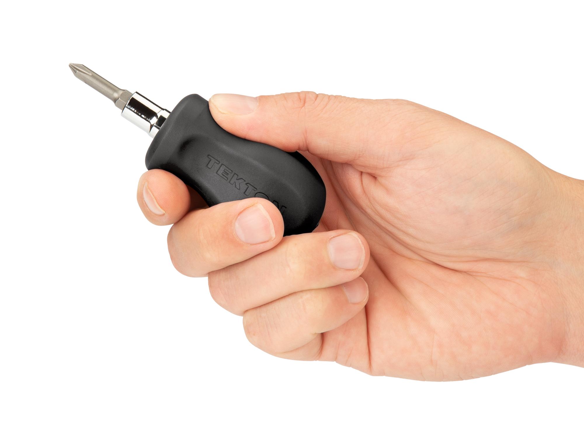 Person holding black Tekton multi-bit driver. Item #DMT13001