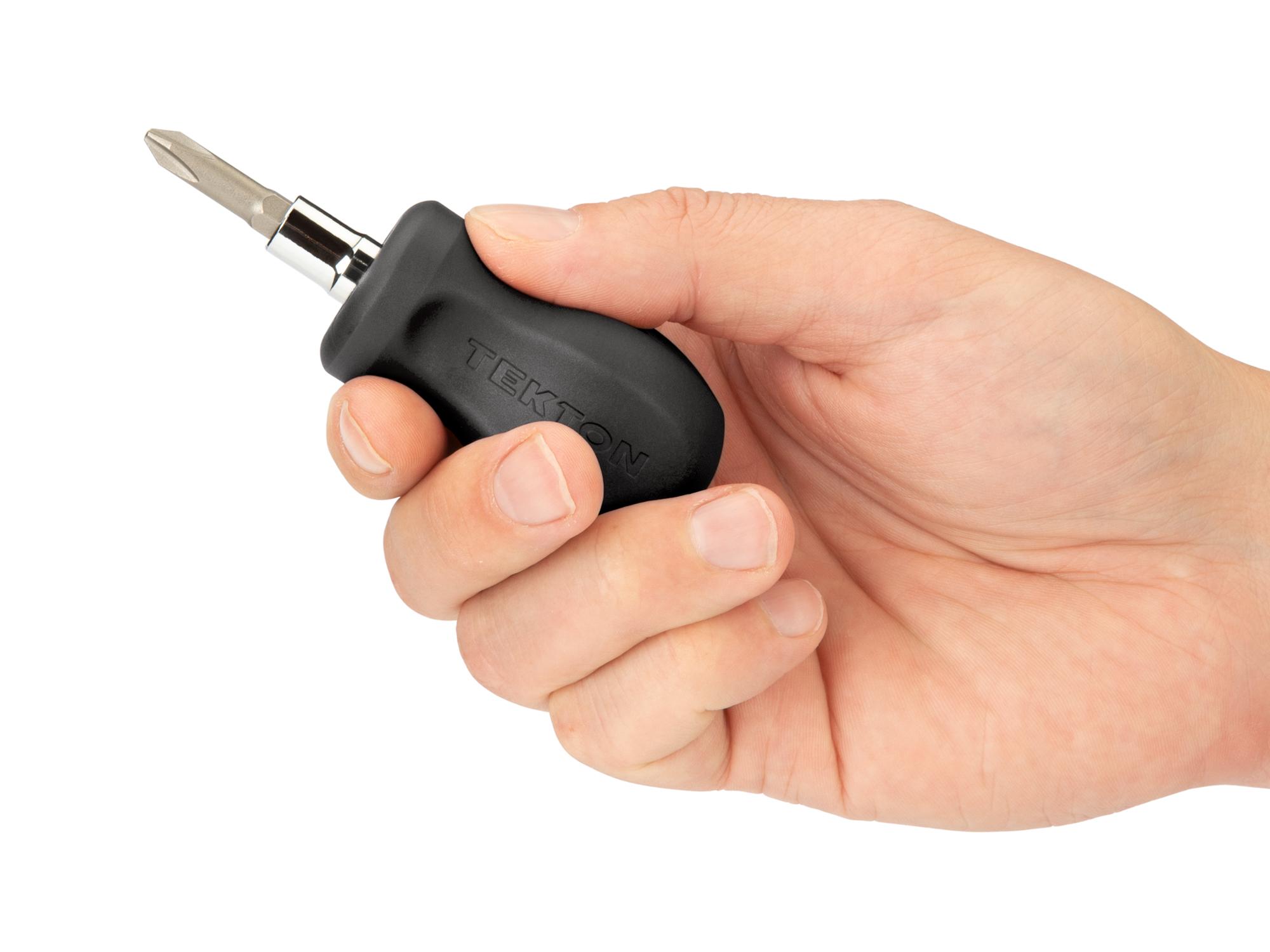 Person holding black Tekton multi-bit driver. Item #DMT13002