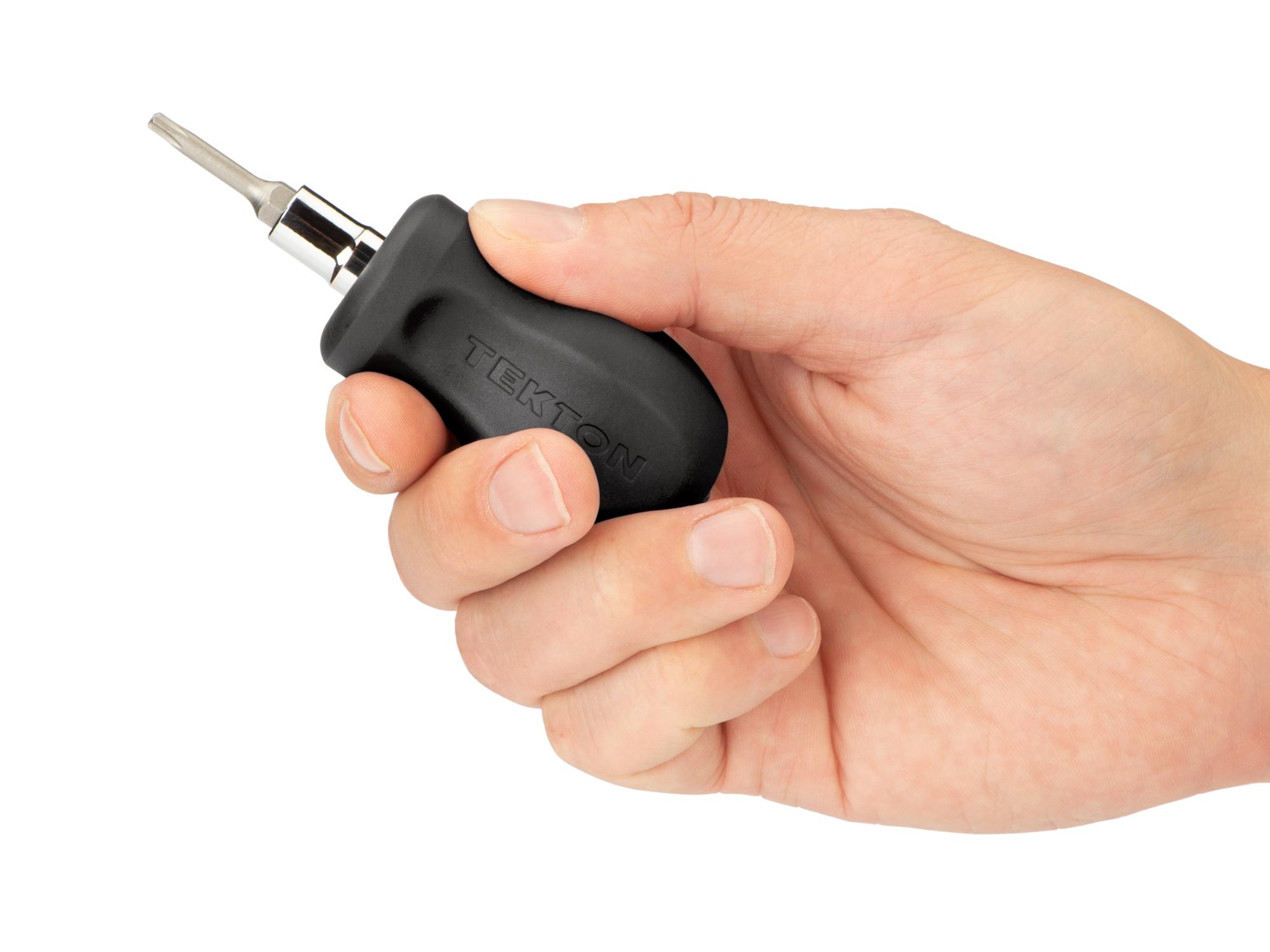Person holding black Tekton multi-bit driver. Item #DMT13003