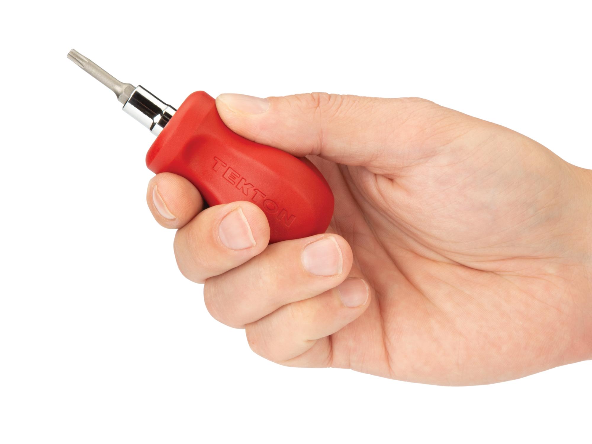 Person holding red Tekton multi-bit driver. Item #DMT17004