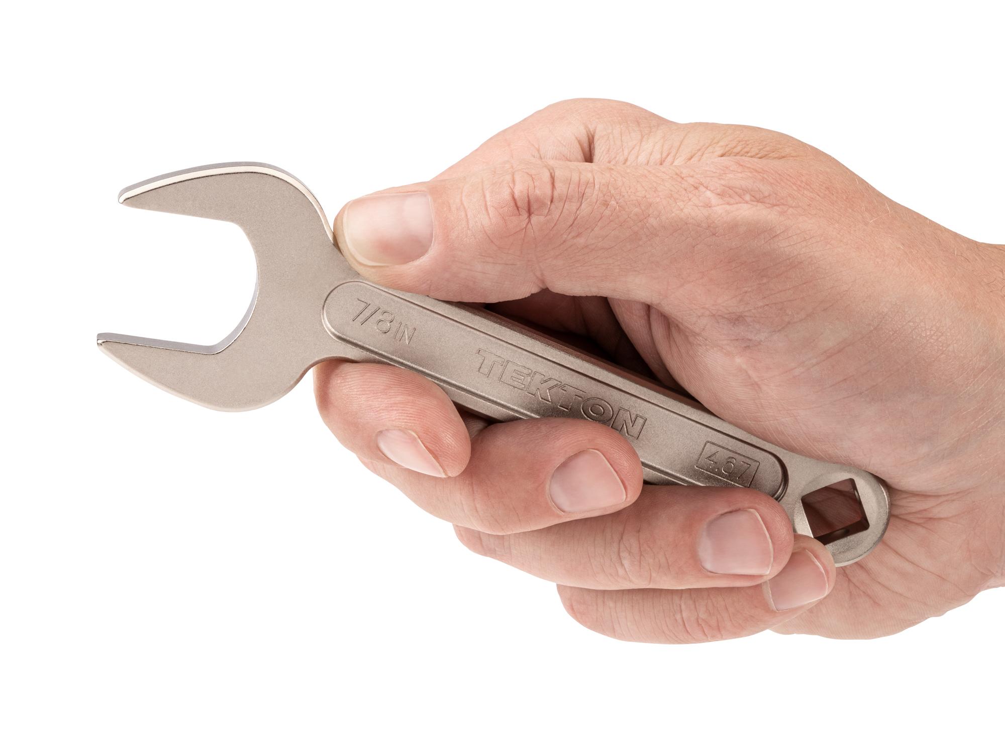 Person holding Tekton service wrench. Item #WSE14322