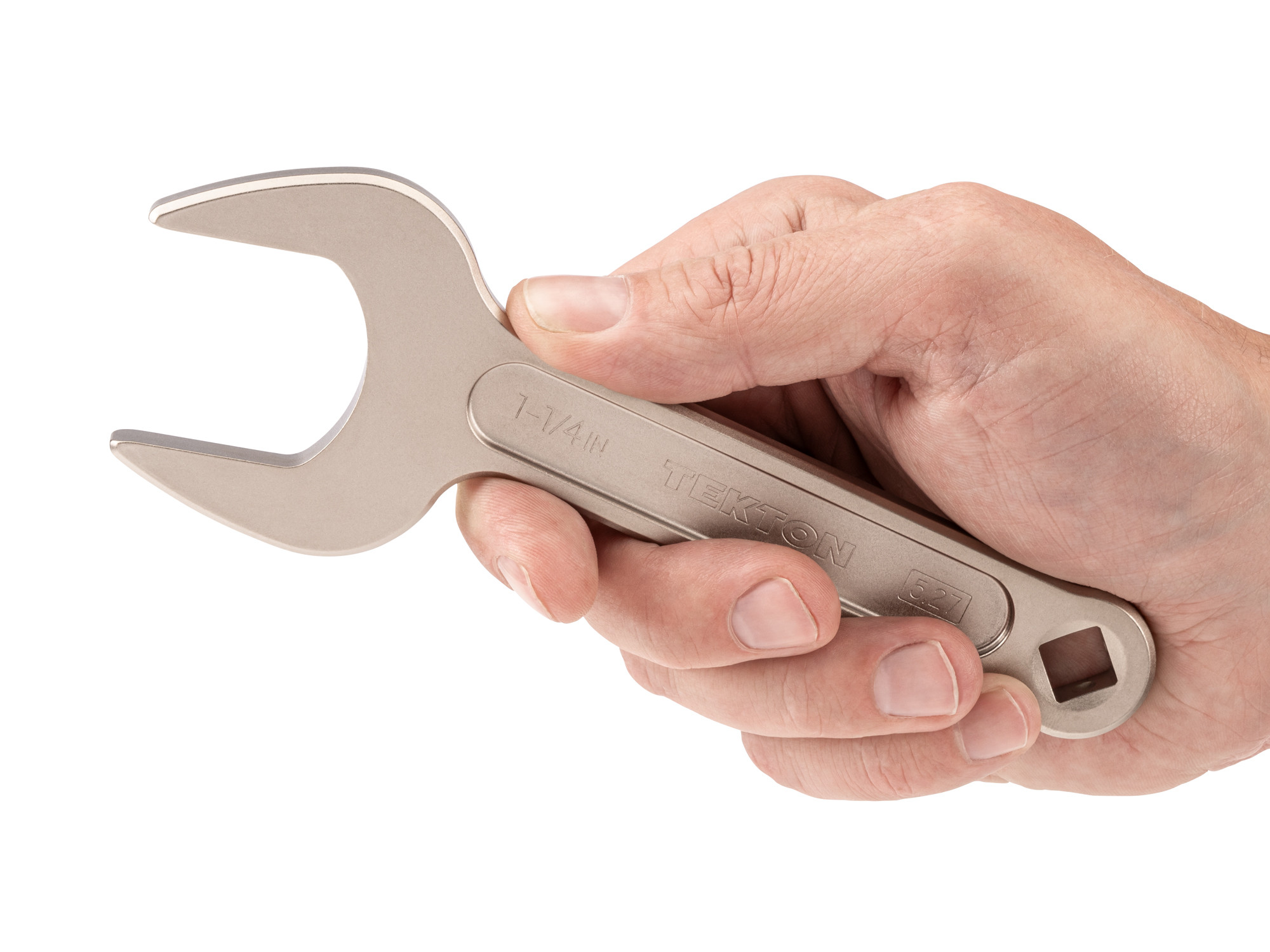 Person holding Tekton 1 1/4 inch open end wrench set. Item #WSE14332