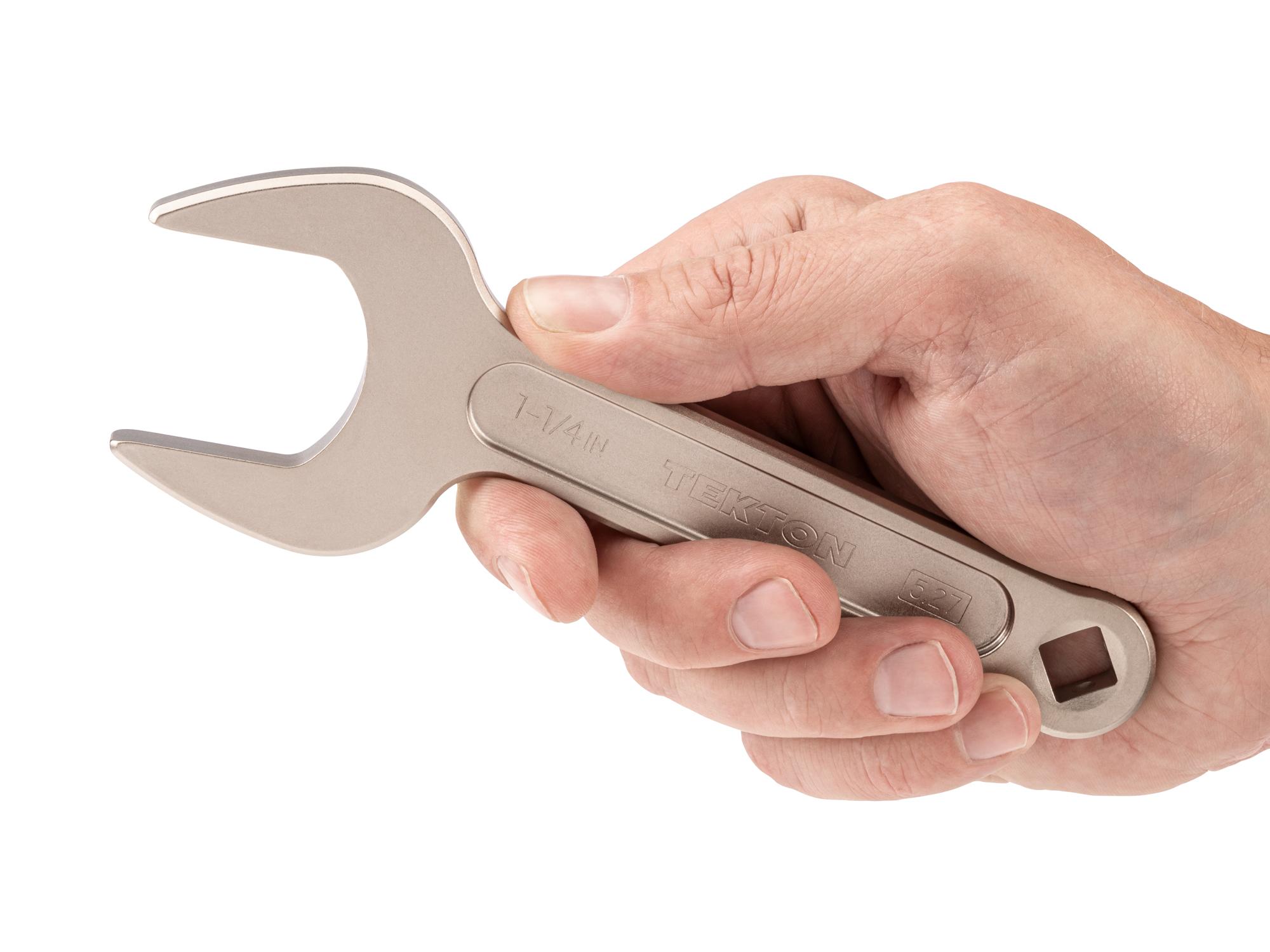 Person holding Tekton service wrench. Item #WSE14332