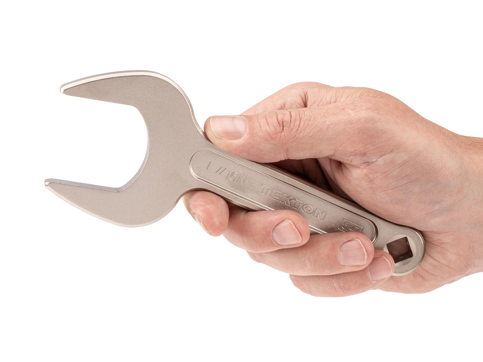 Person holding Tekton service wrench. Item #WSE14336