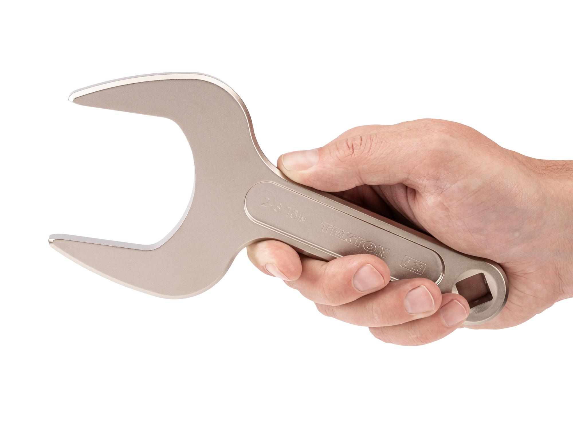 Person holding Tekton service wrench. Item #WSE14355