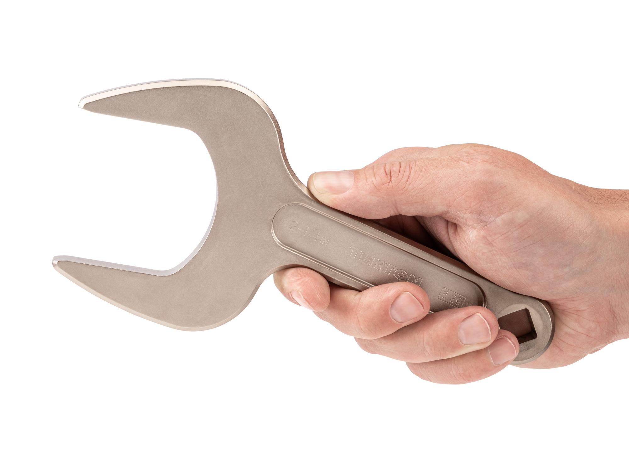 Person holding Tekton service wrench. Item #WSE14357