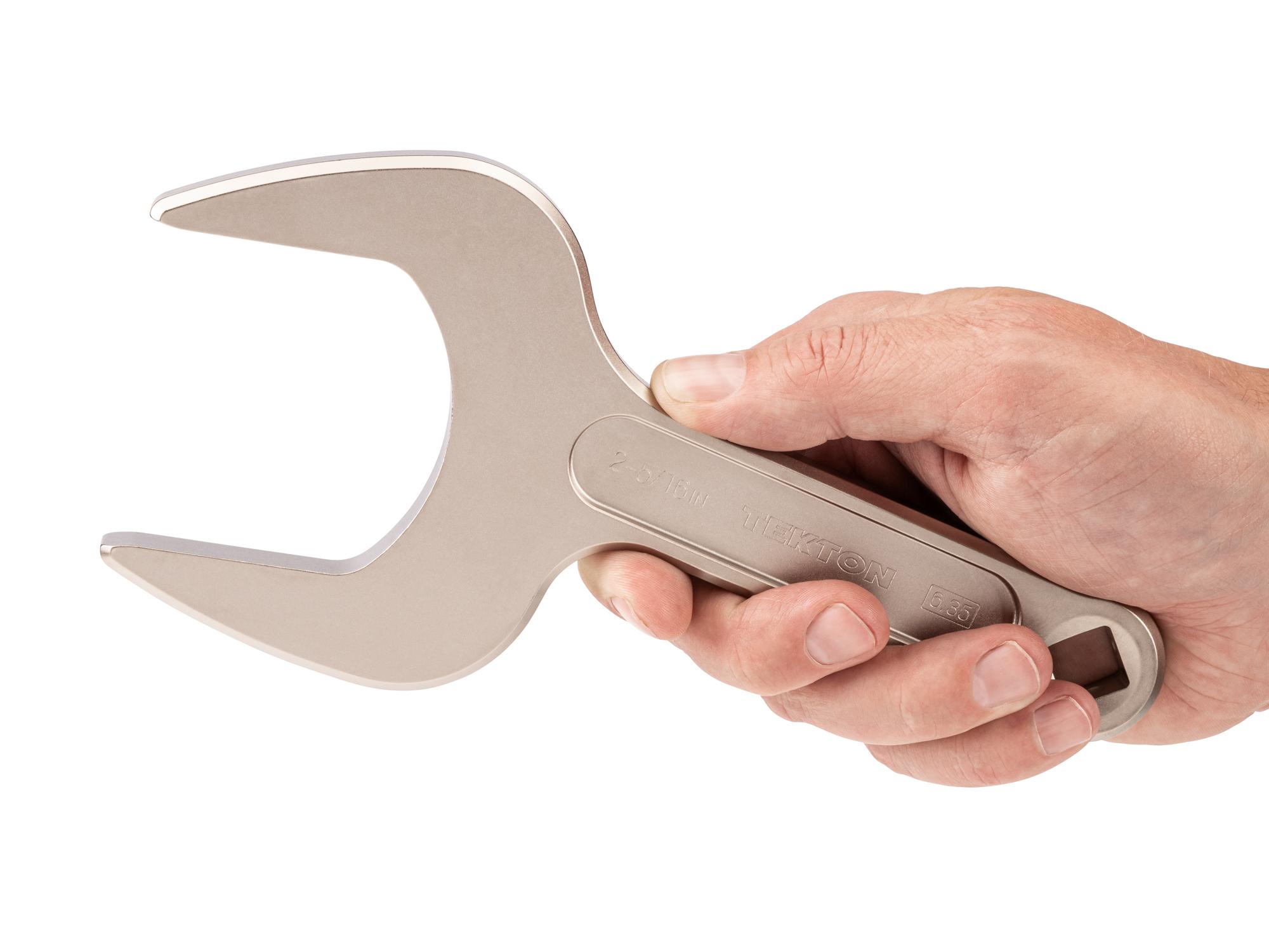 Person holding Tekton service wrench. Item #WSE14359