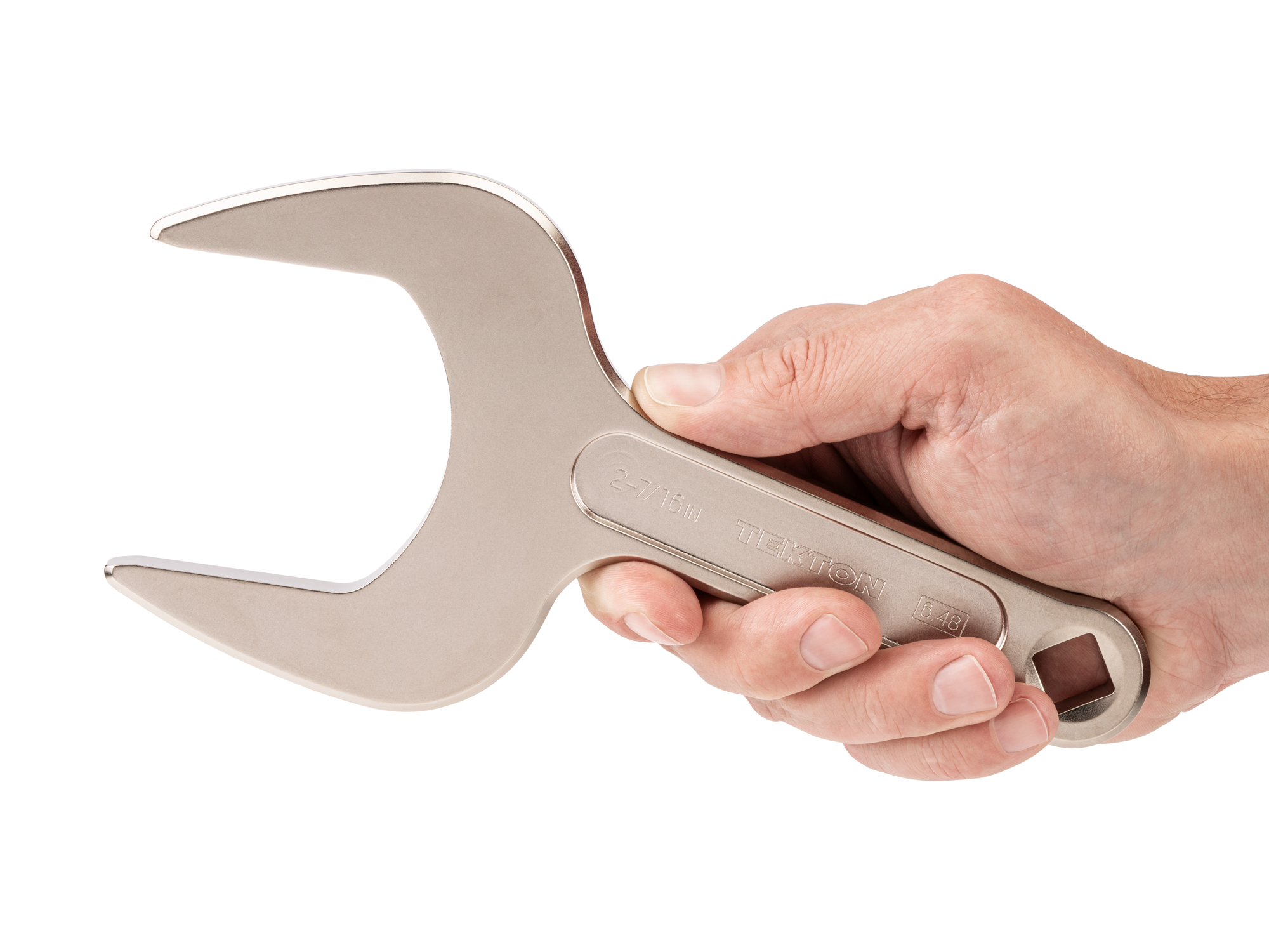 Person holding Tekton 2 7/16 inch open end wrench set. Item #WSE14362