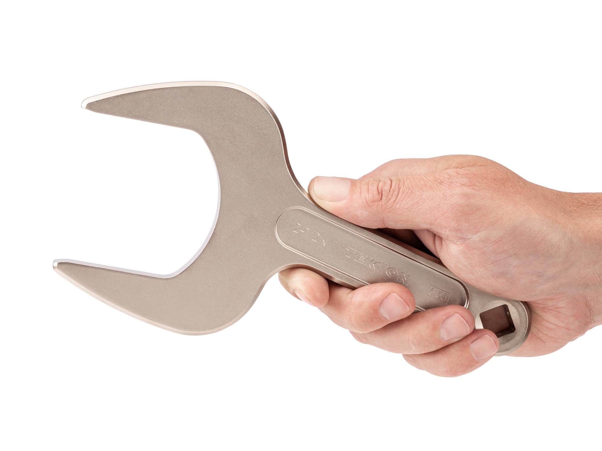 Person holding Tekton service wrench. Item #WSE14363