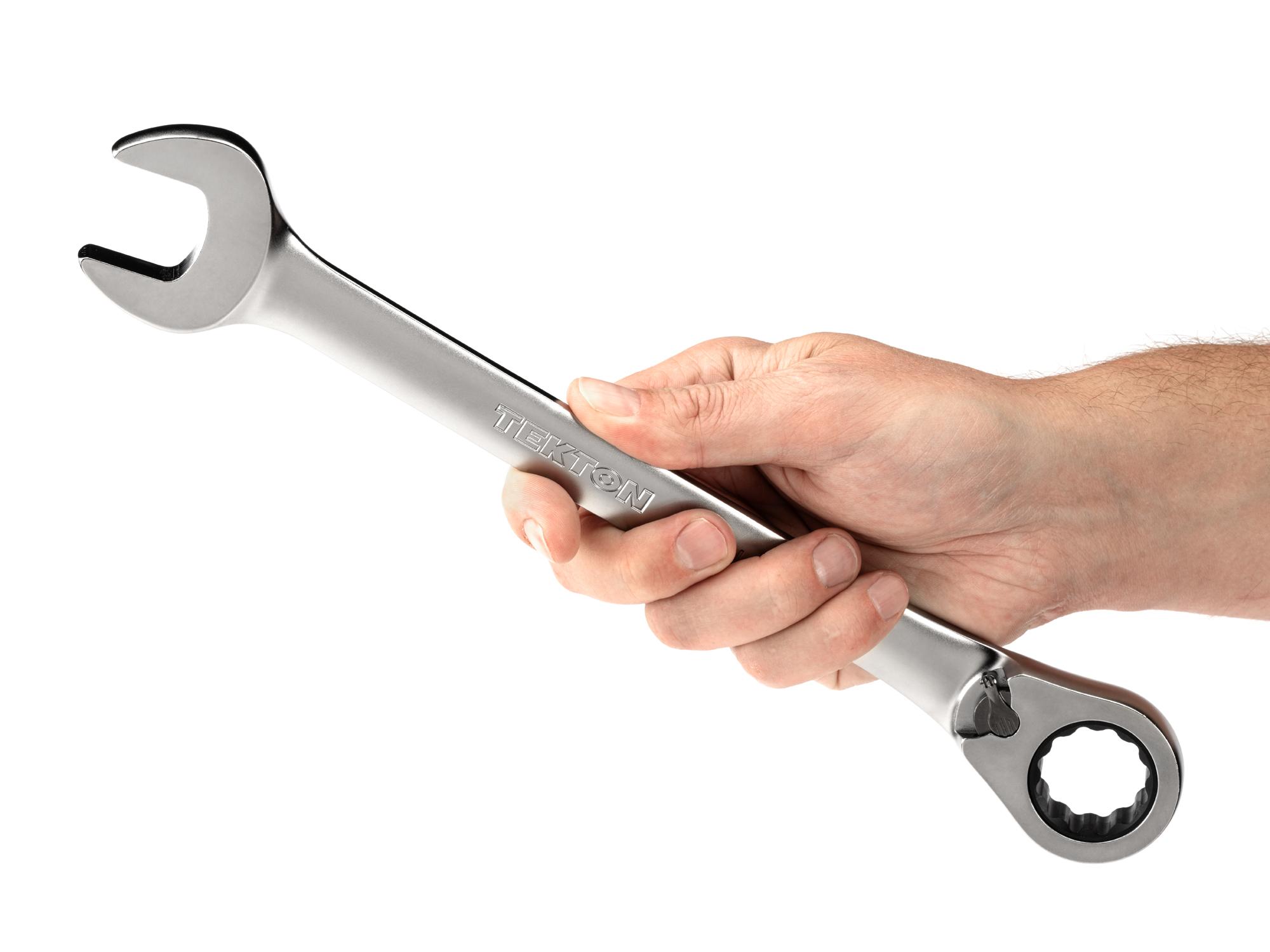 Person holding Tekton ratcheting combination wrench. Item #WRC23325