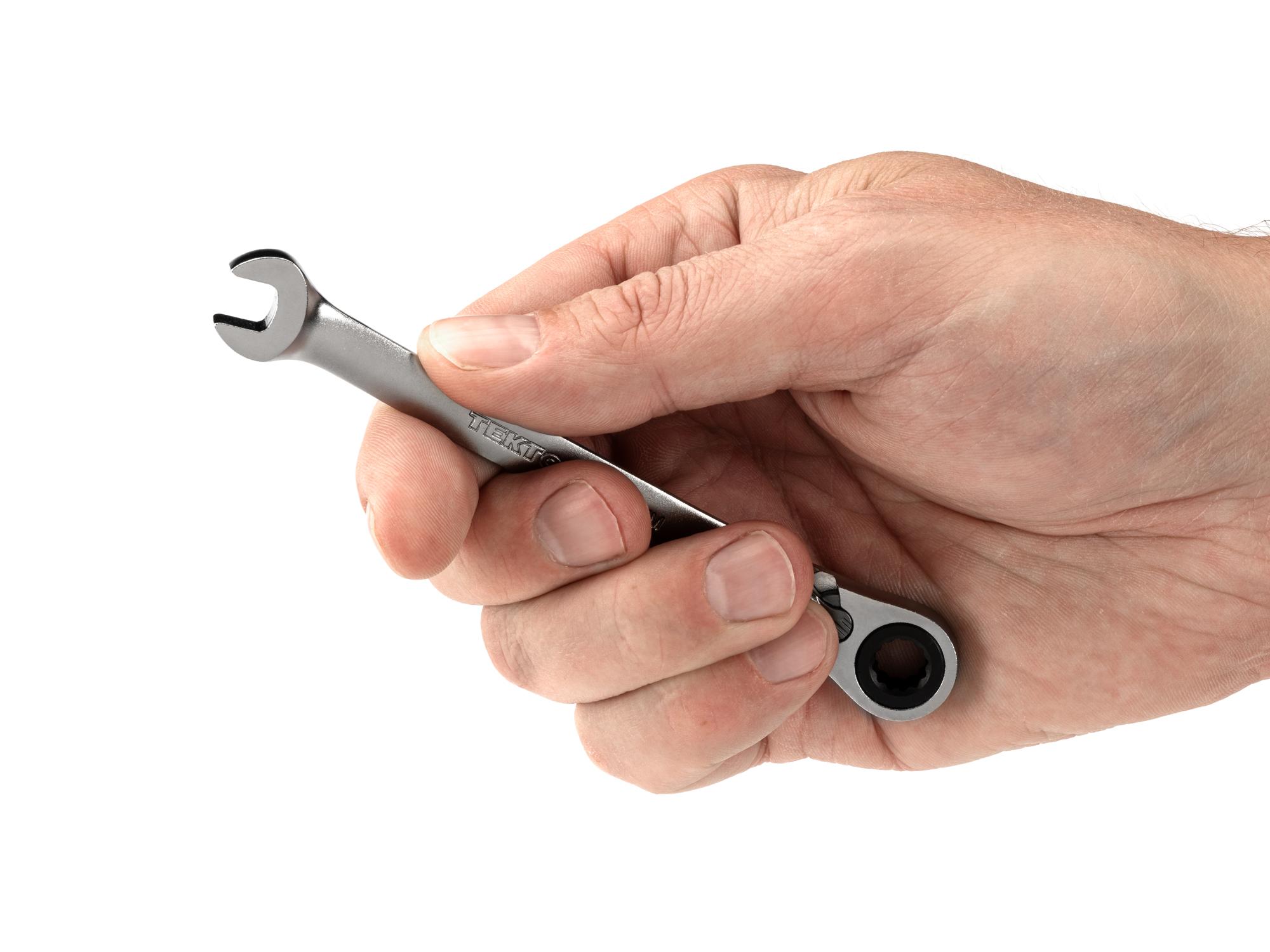 Person holding Tekton ratcheting combination wrench. Item #WRC23407