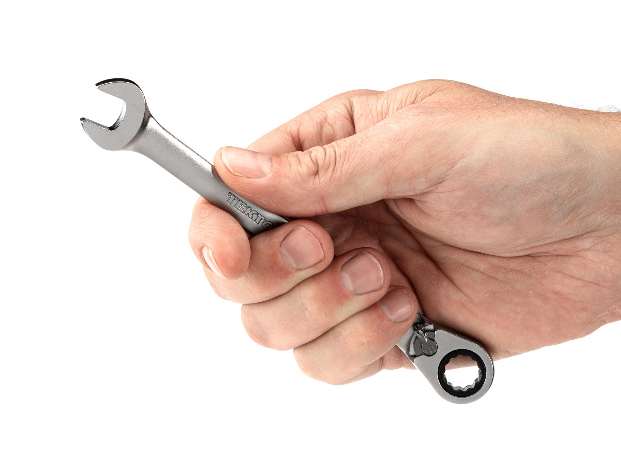 Person holding Tekton ratcheting combination wrench. Item #WRC23410