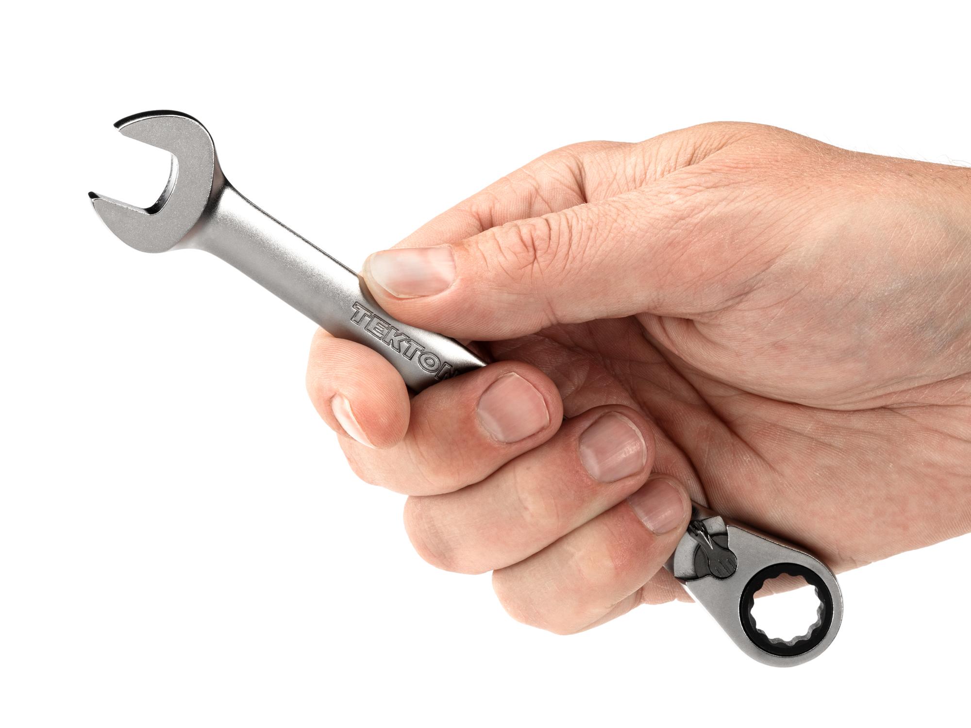 Person holding Tekton ratcheting combination wrench. Item #WRC23412