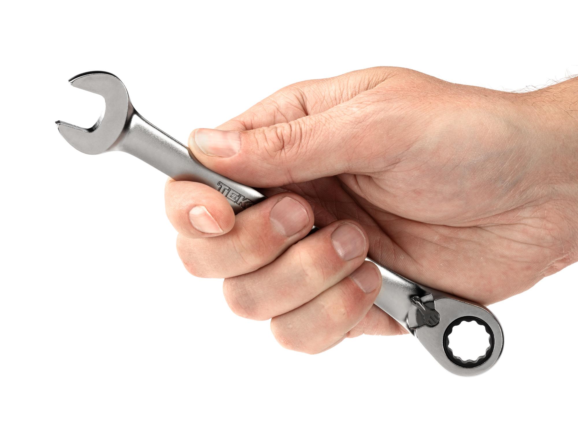 Person holding Tekton ratcheting combination wrench. Item #WRC23413