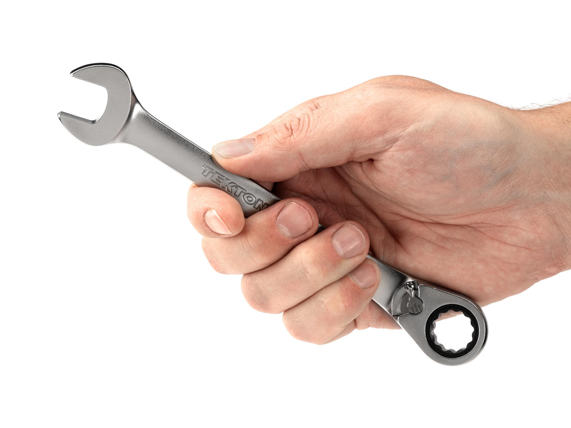 Person holding Tekton ratcheting combination wrench. Item #WRC23414
