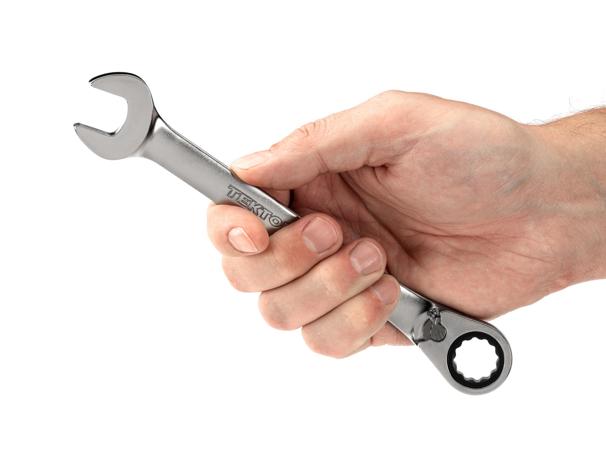 Person holding Tekton ratcheting combination wrench. Item #WRC23415