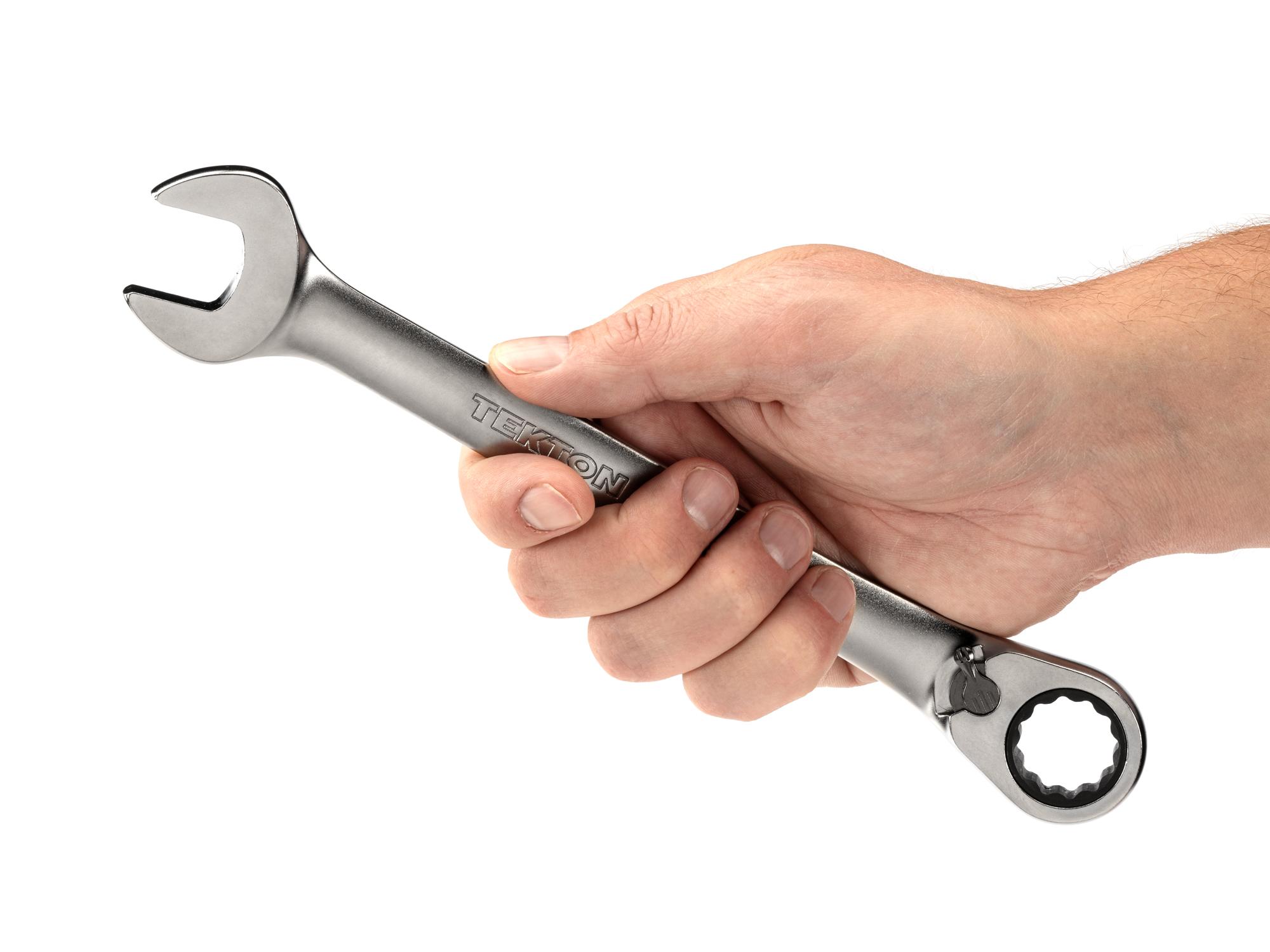 Person holding Tekton ratcheting combination wrench. Item #WRC23419