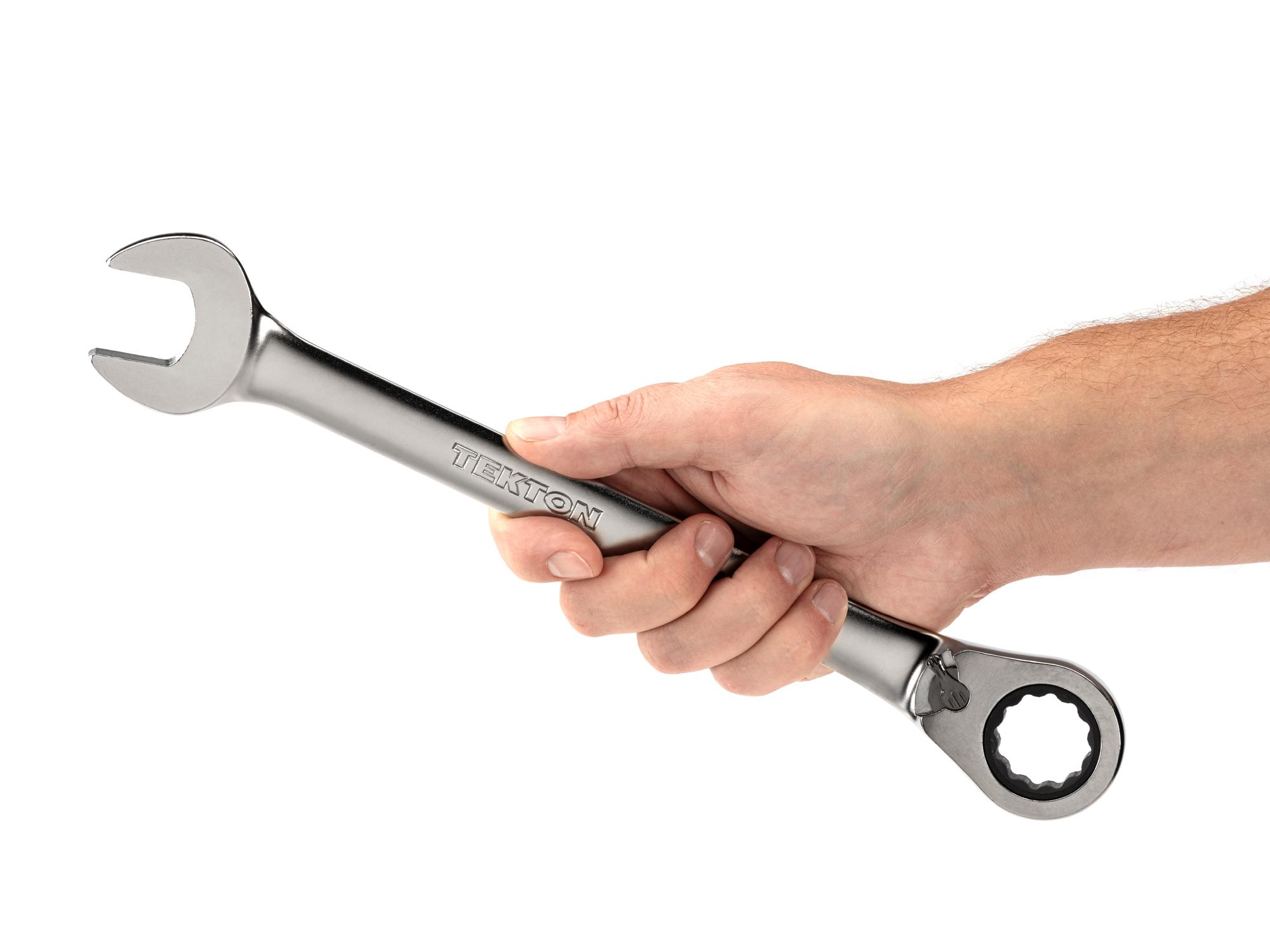 Person holding Tekton ratcheting combination wrench. Item #WRC23424