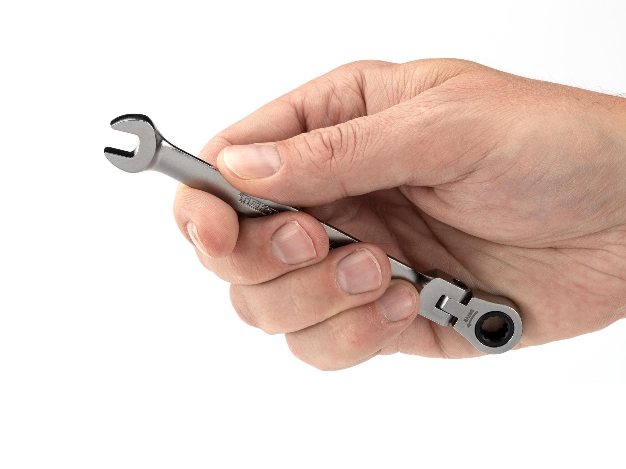 Person holding Tekton ratcheting combination wrench. Item #WRC26307