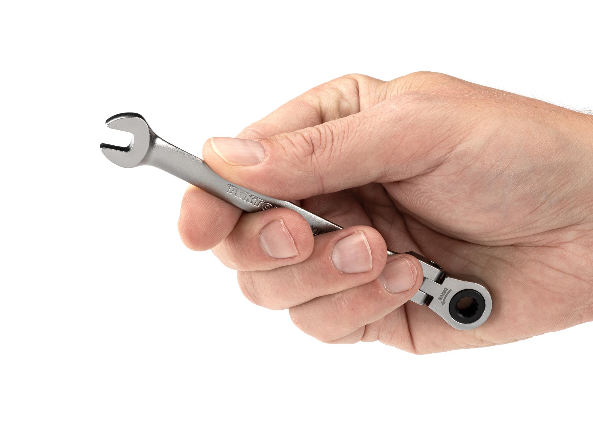 Person holding Tekton ratcheting combination wrench. Item #WRC26406