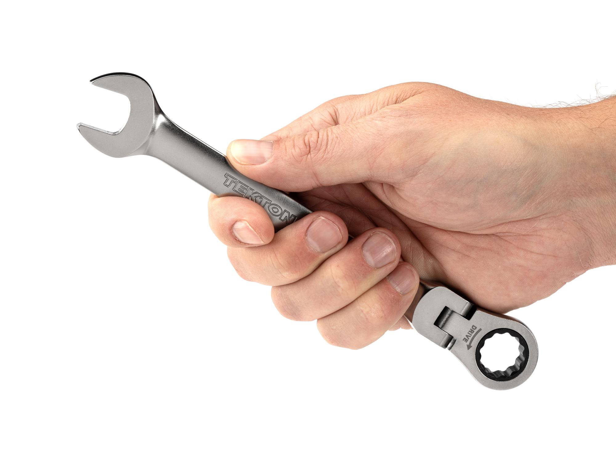 Person holding Tekton ratcheting combination wrench. Item #WRC26415
