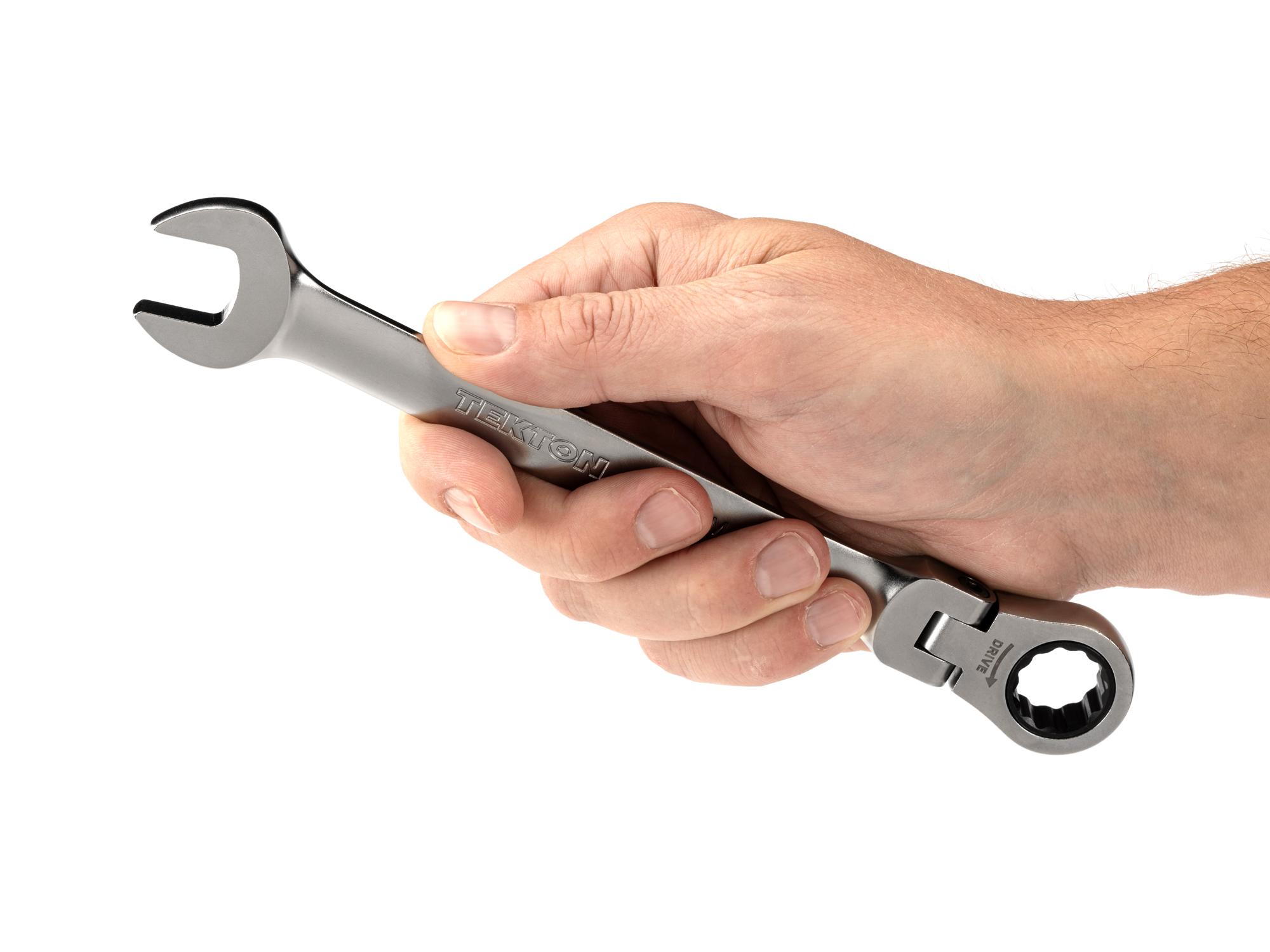 Person holding Tekton ratcheting combination wrench. Item #WRC26416