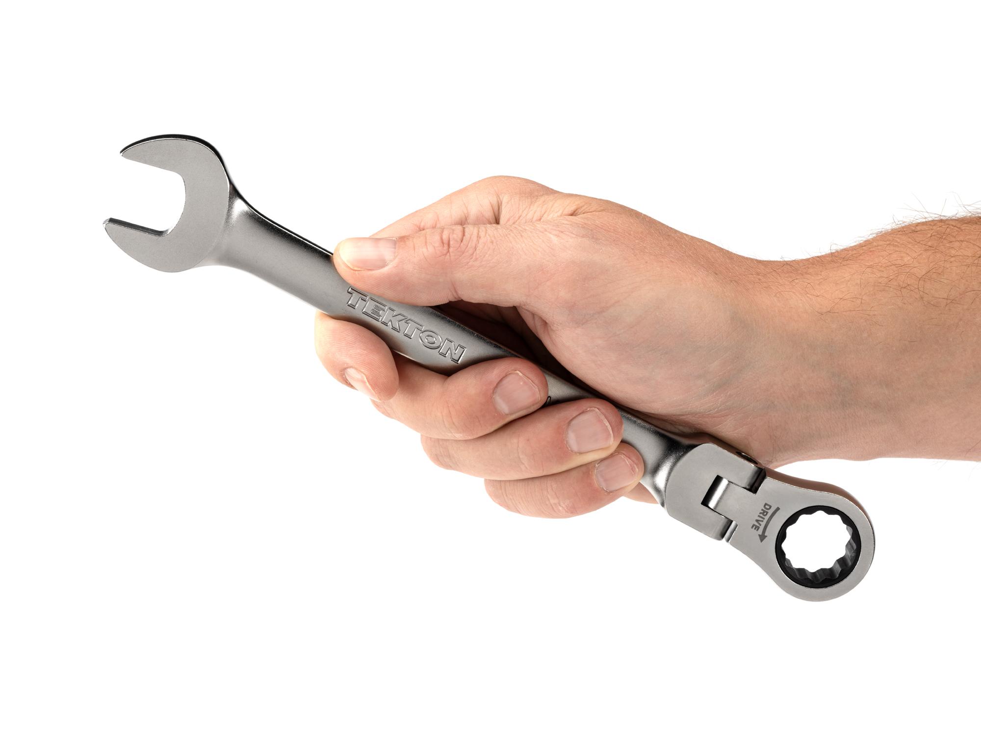 Person holding Tekton ratcheting combination wrench. Item #WRC26418