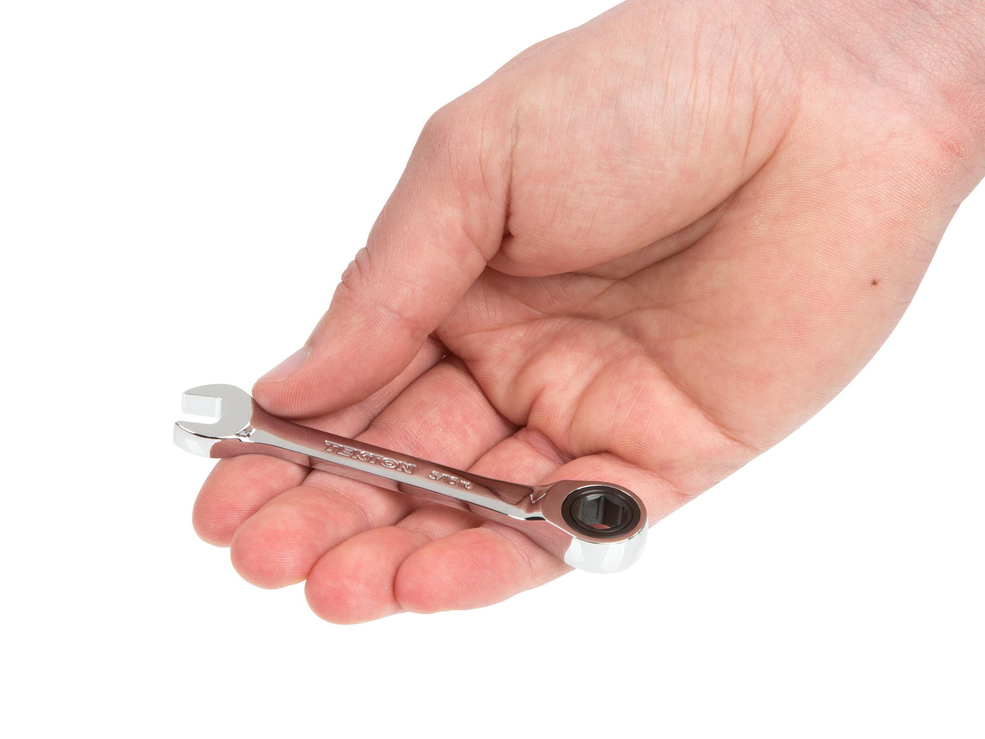 Person holding Tekton ratcheting combination wrench. Item #WRN50006
