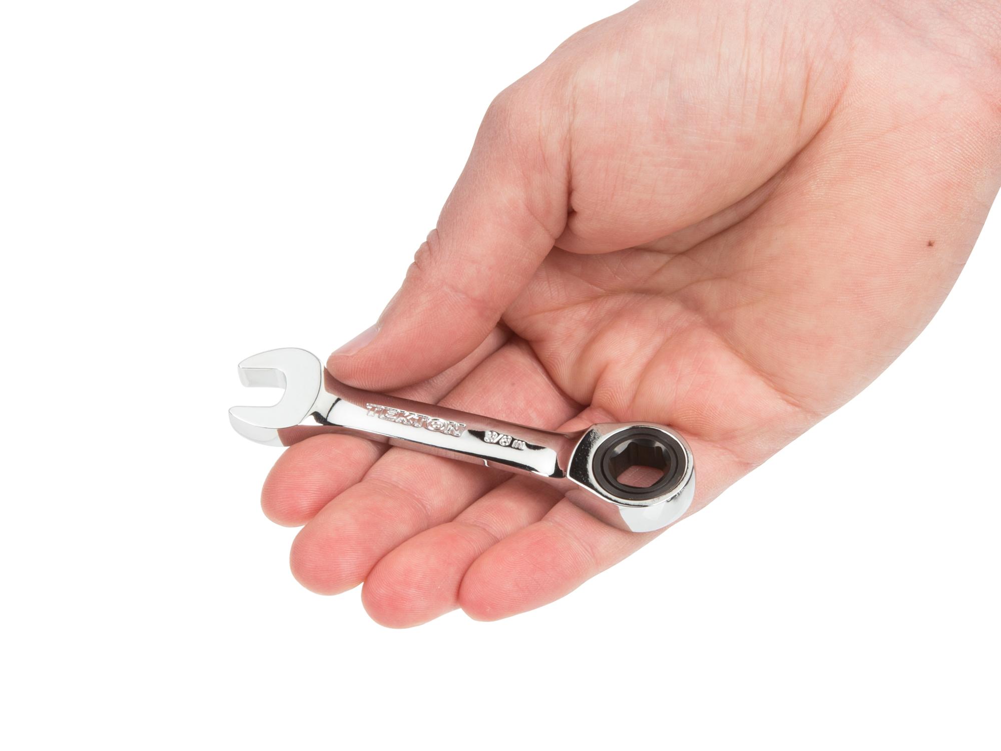Person holding Tekton ratcheting combination wrench. Item #WRN50008