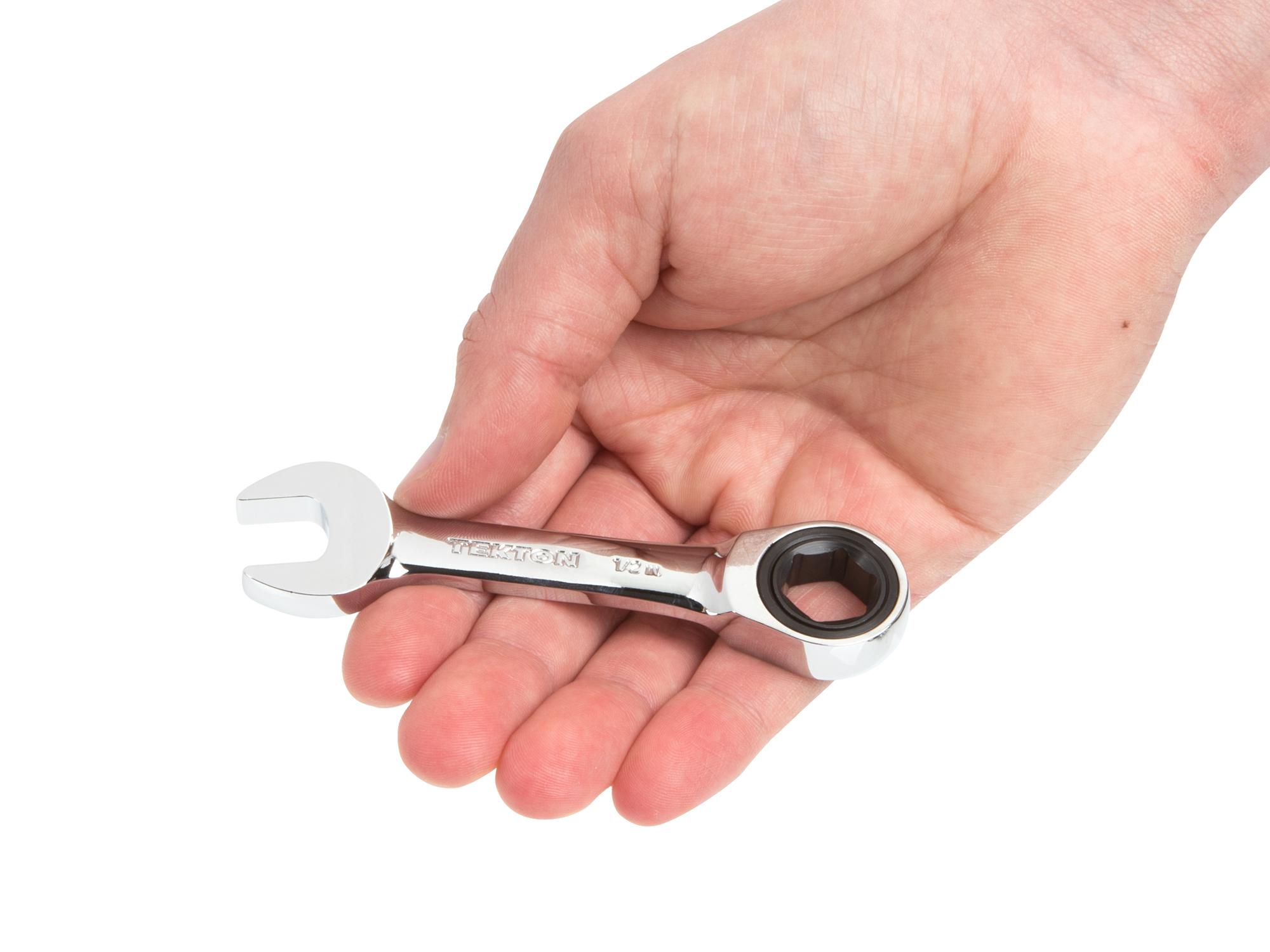 Person holding Tekton ratcheting combination wrench. Item #WRN50010